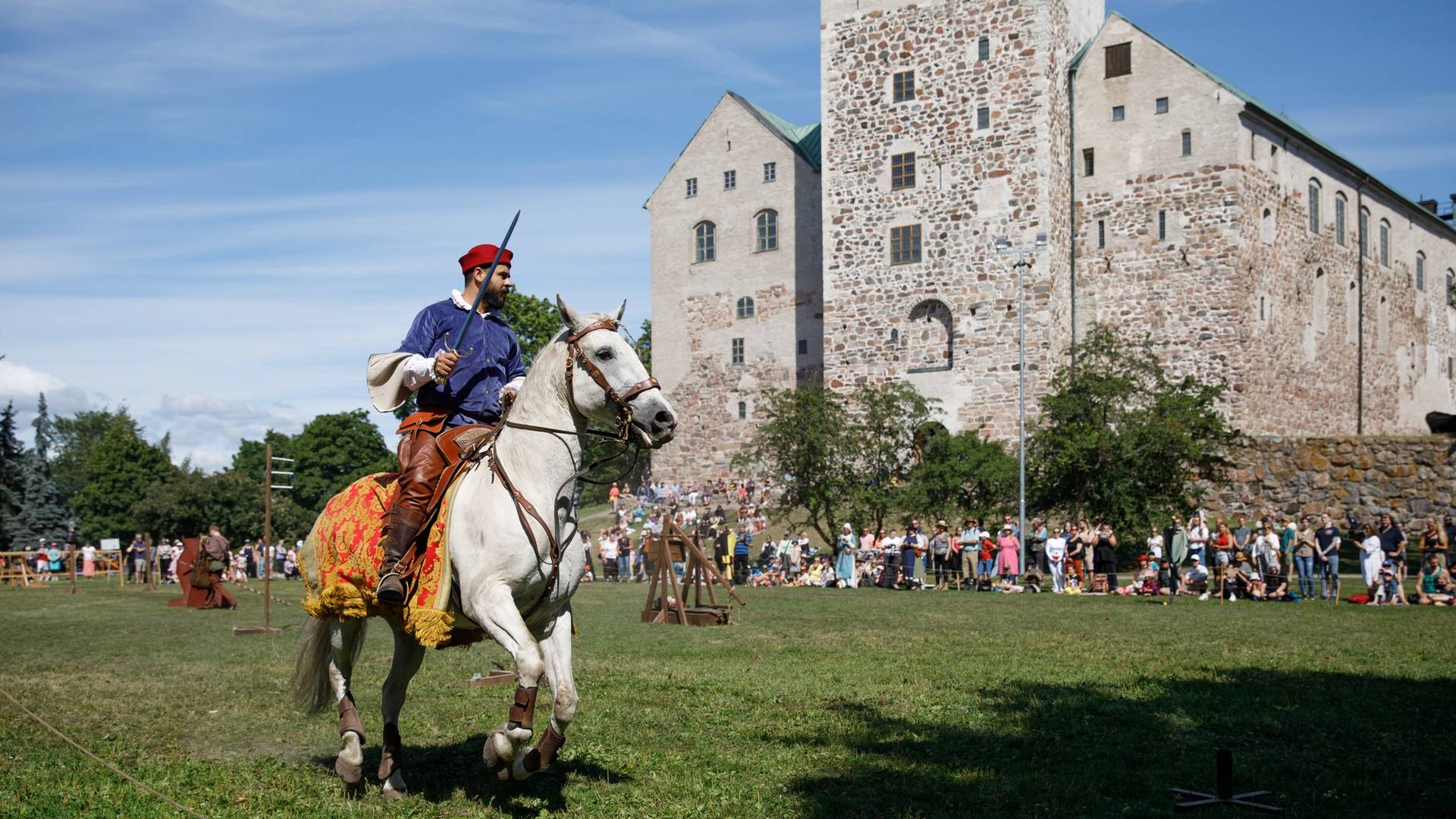 A horse rider on the yard of the Turku Castle.