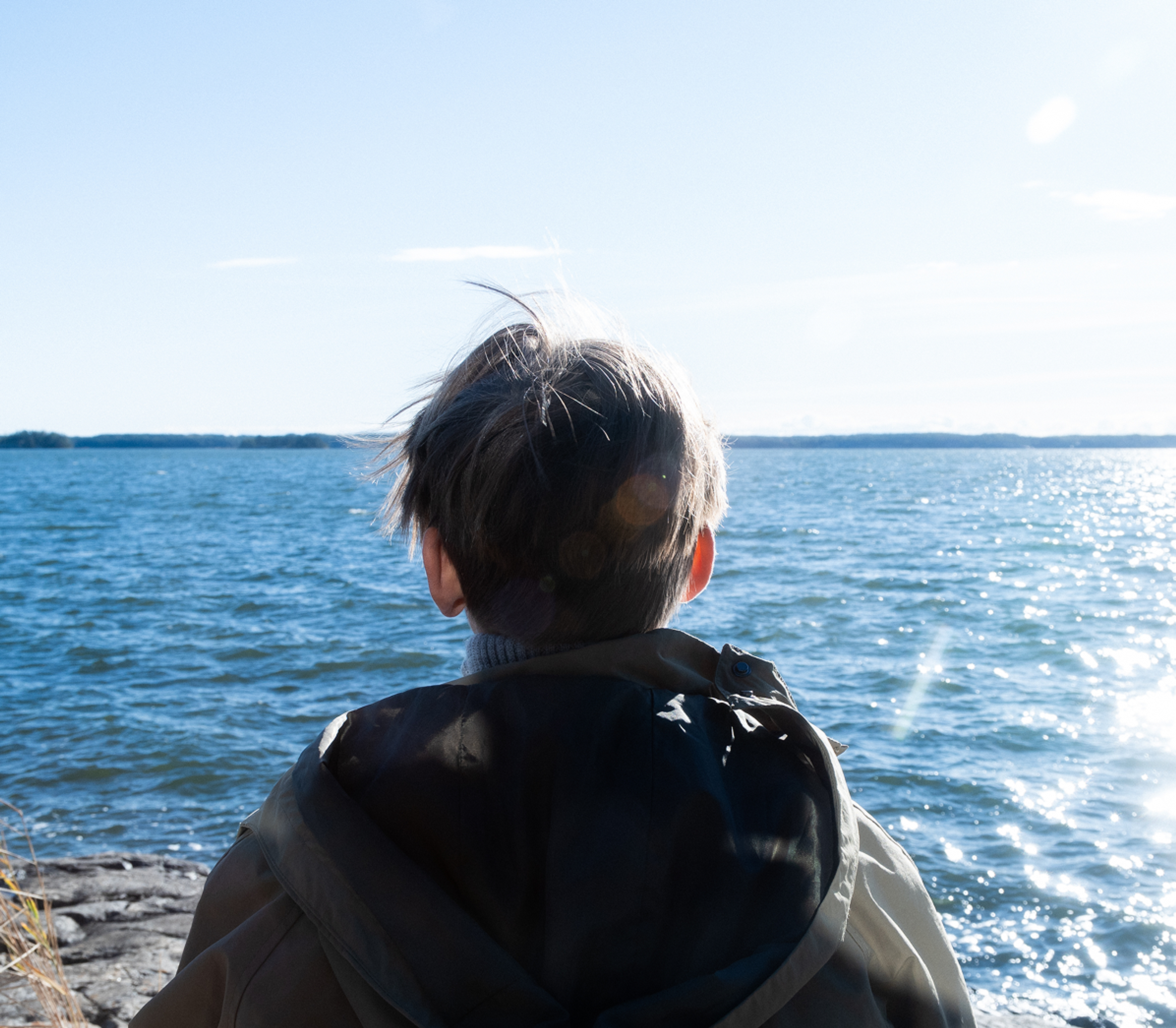 A child watching the horizon in the Finnish archipelago.