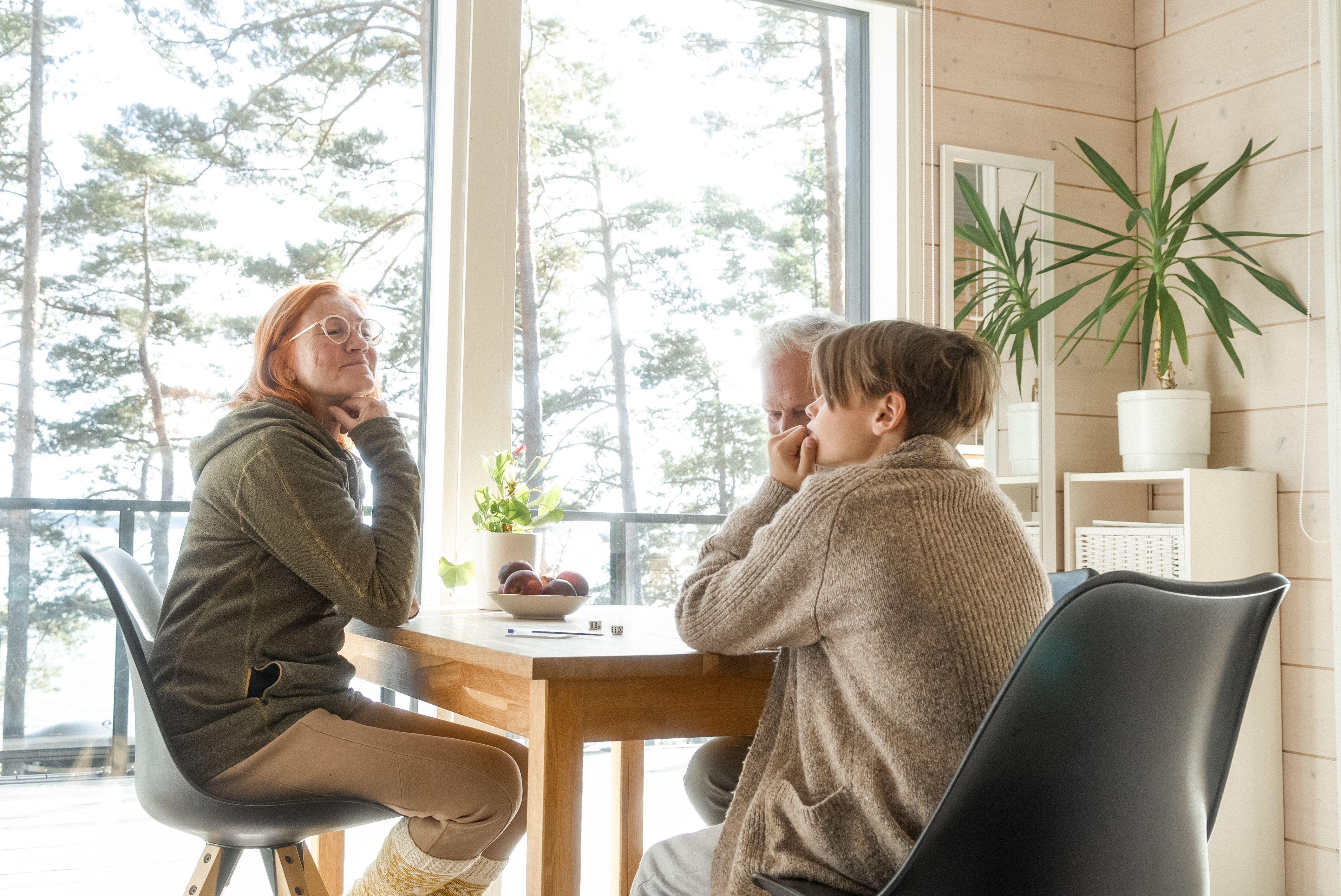 People around the table in a cabin.
