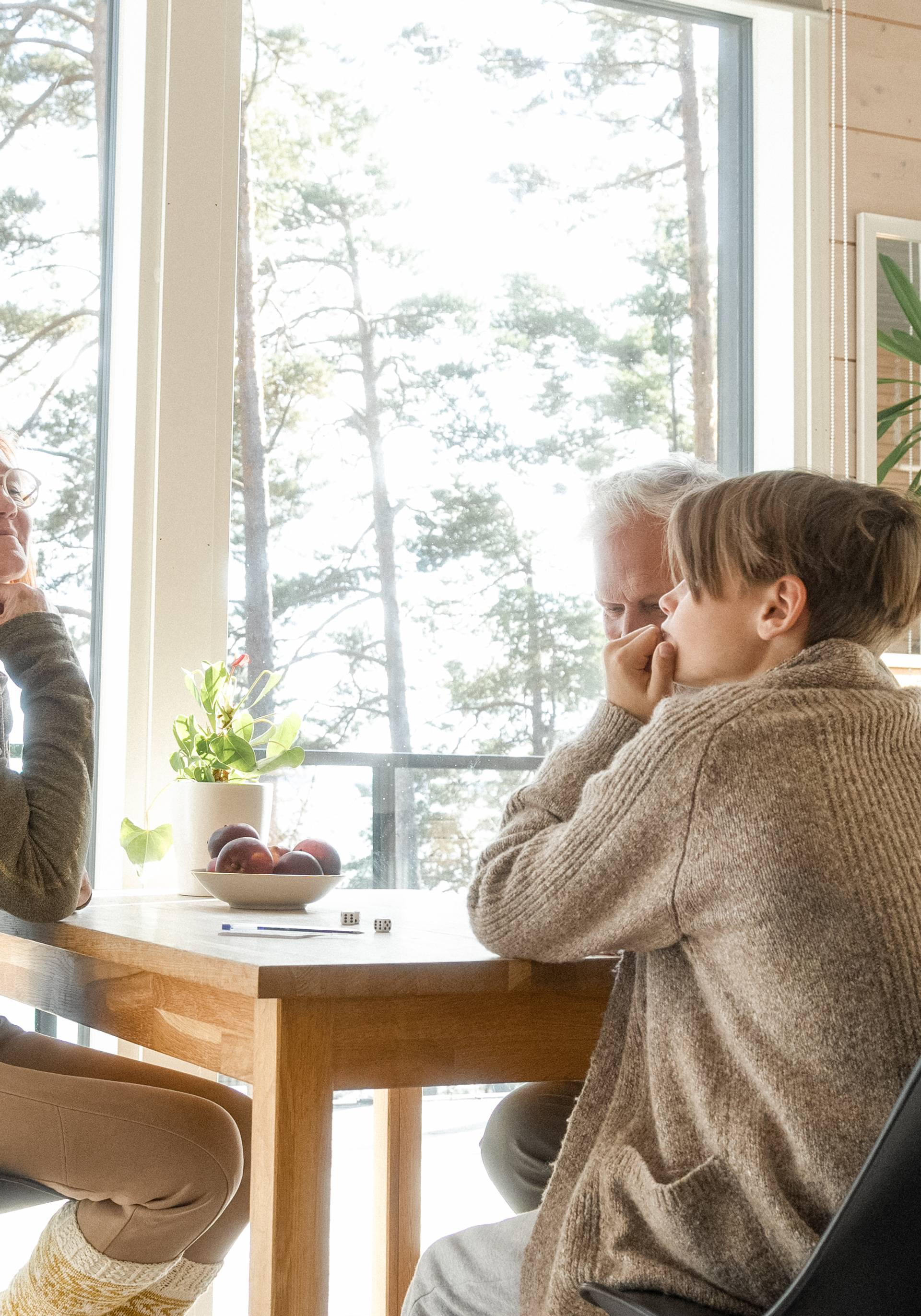 People around the table in a cabin.