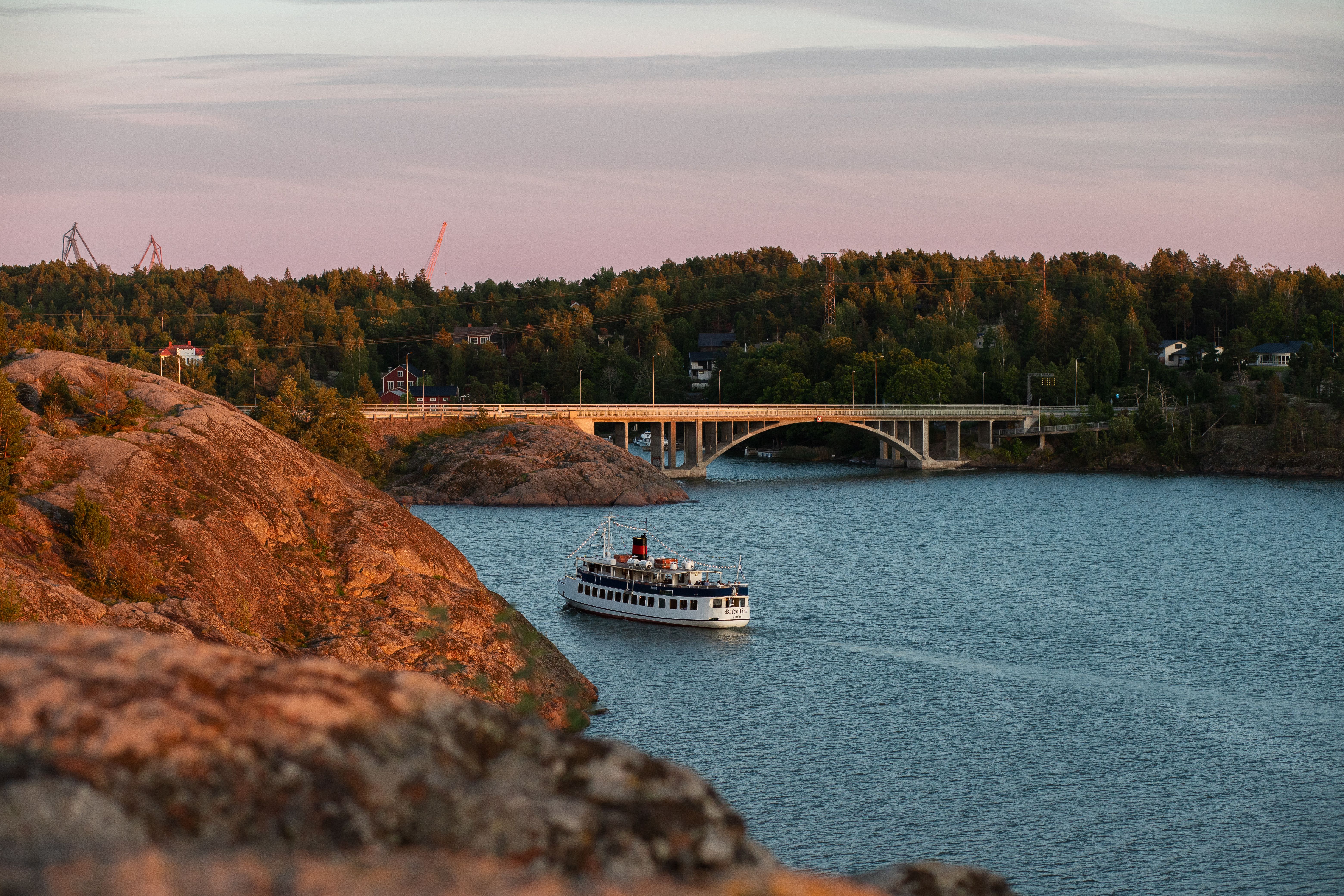 A boat heading towards the Ukko-Pekka bridge in Naantali.