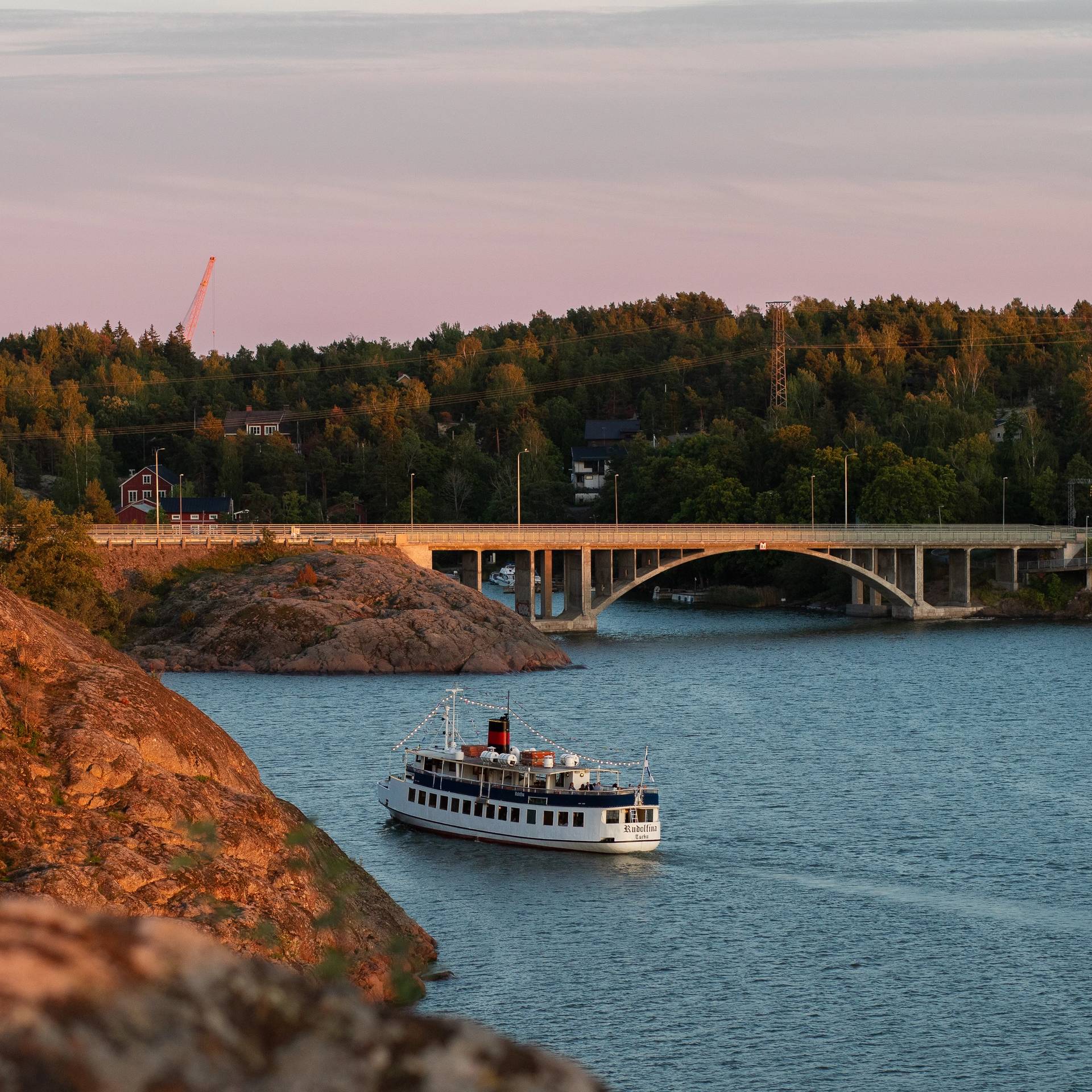 A boat heading towards the Ukko-Pekka bridge in Naantali.