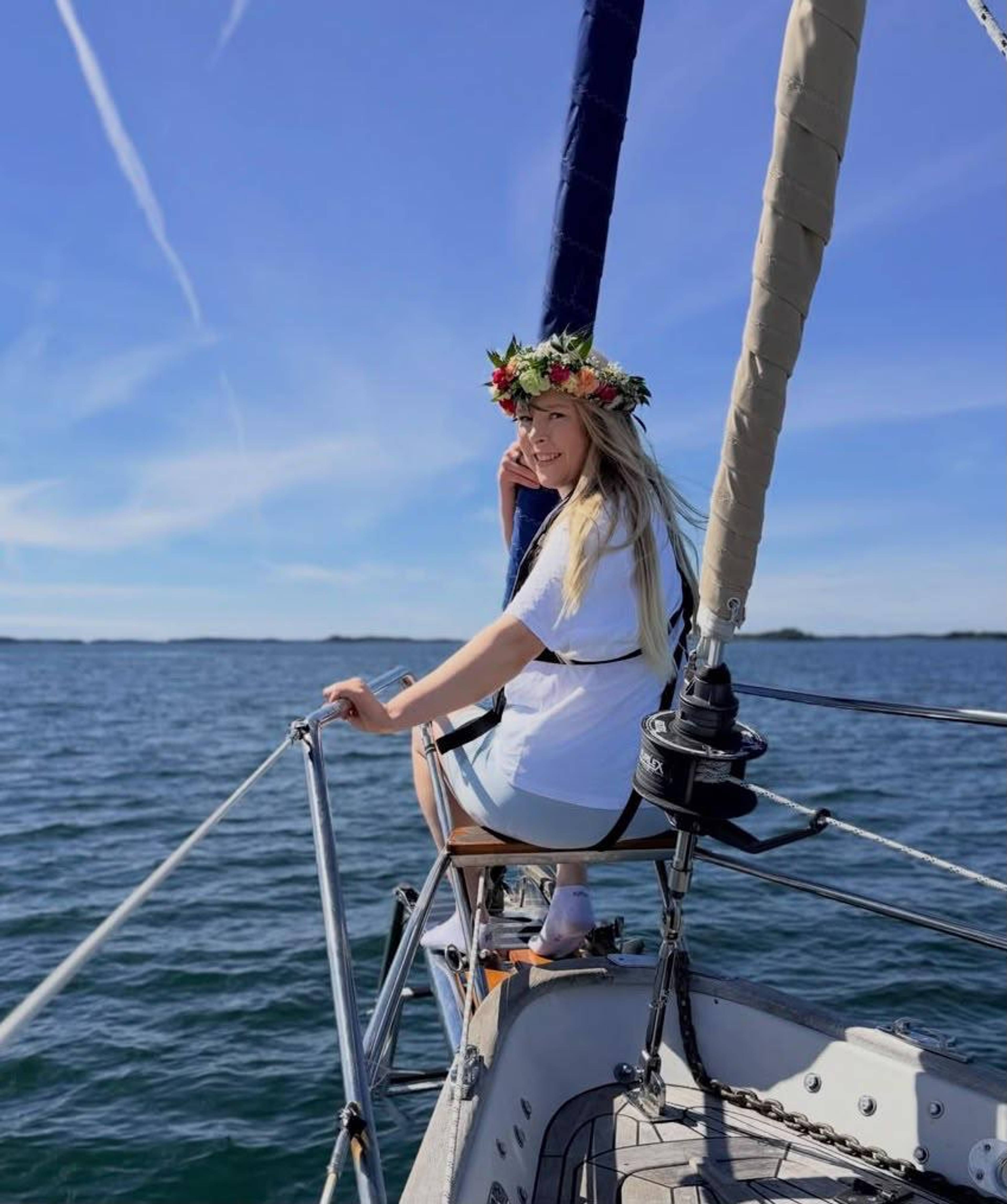 A person onboard a boat at sea.