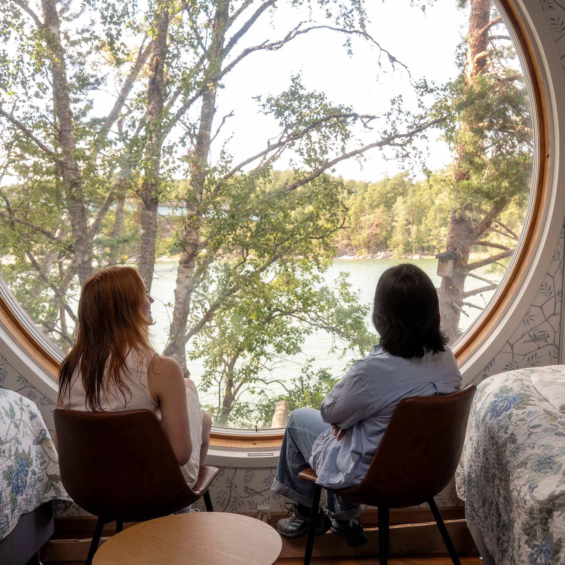 Two women enjoying a view in an archipelago cottage.