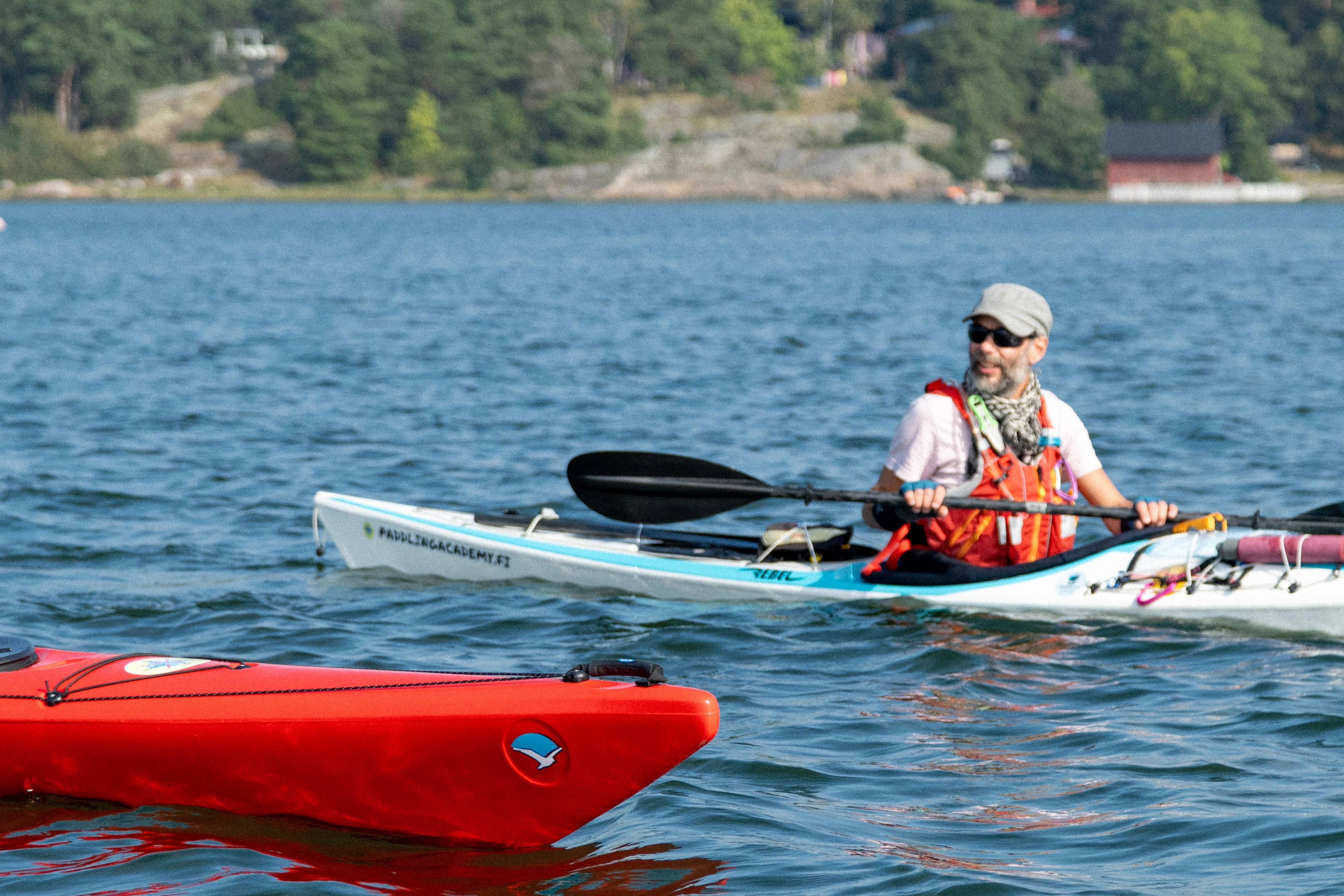 Kayaking guide Gabriel instructing a paddler.