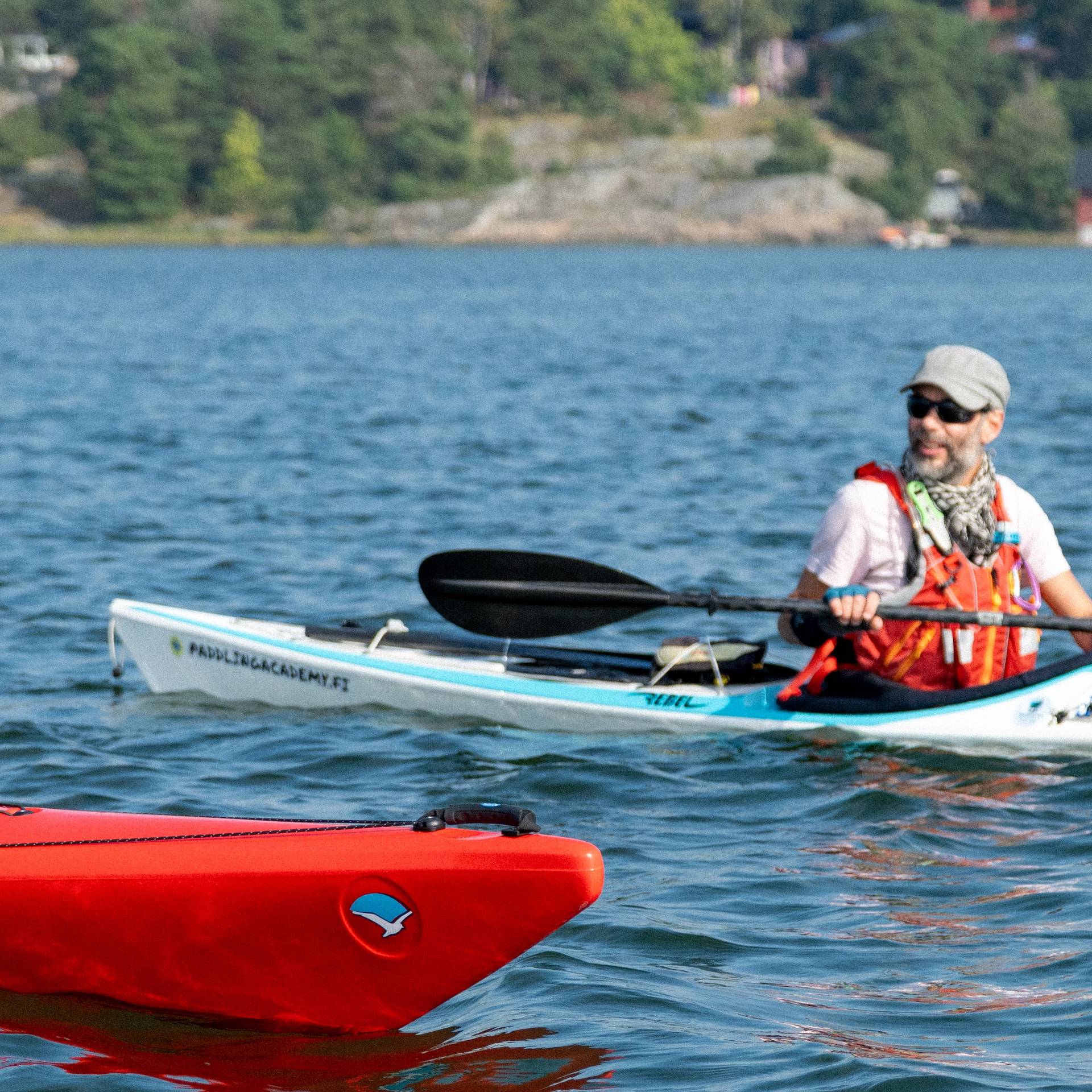 People kayaking among rocky islets.