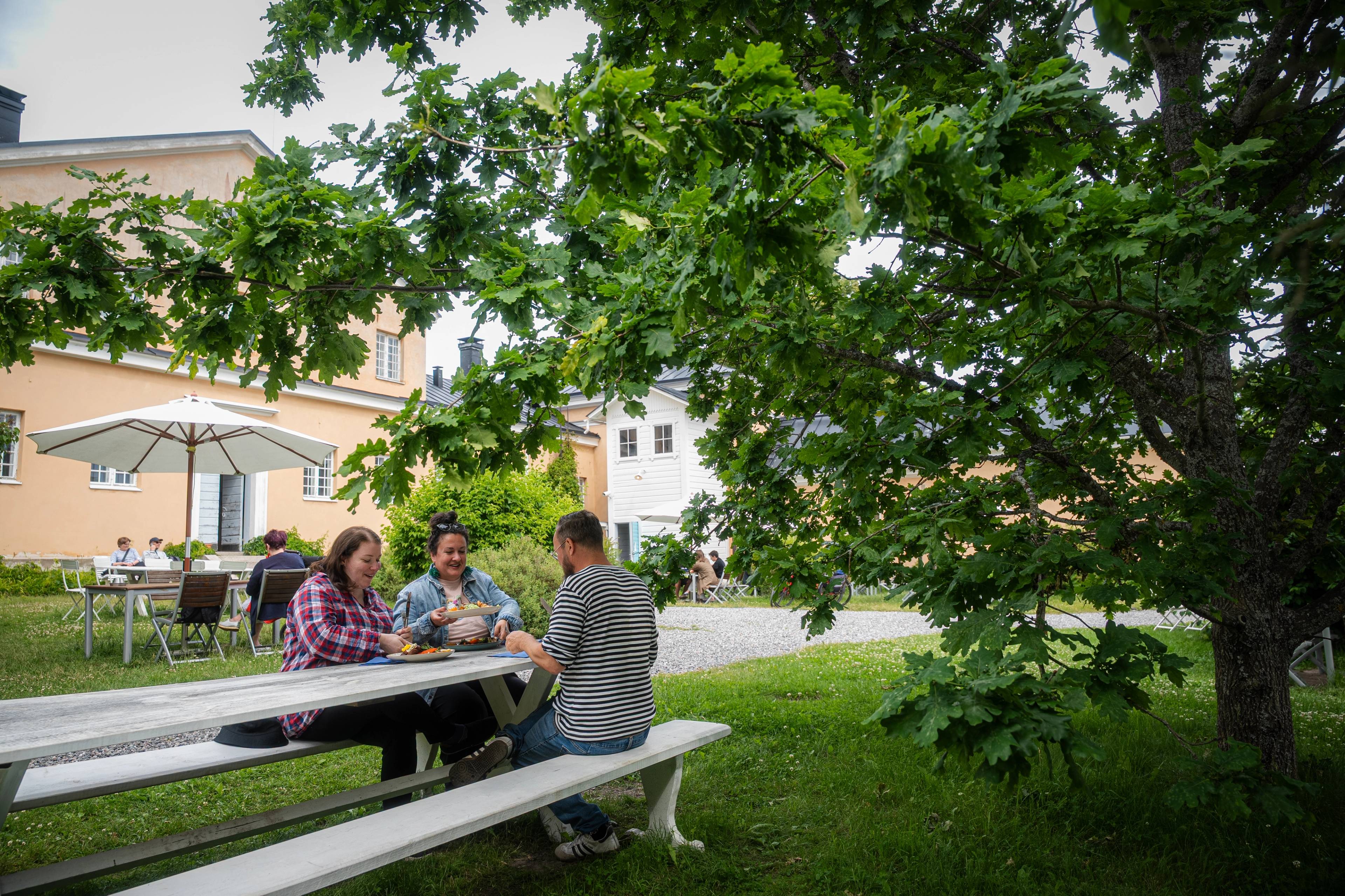 People enjoying a snack on Seili island.