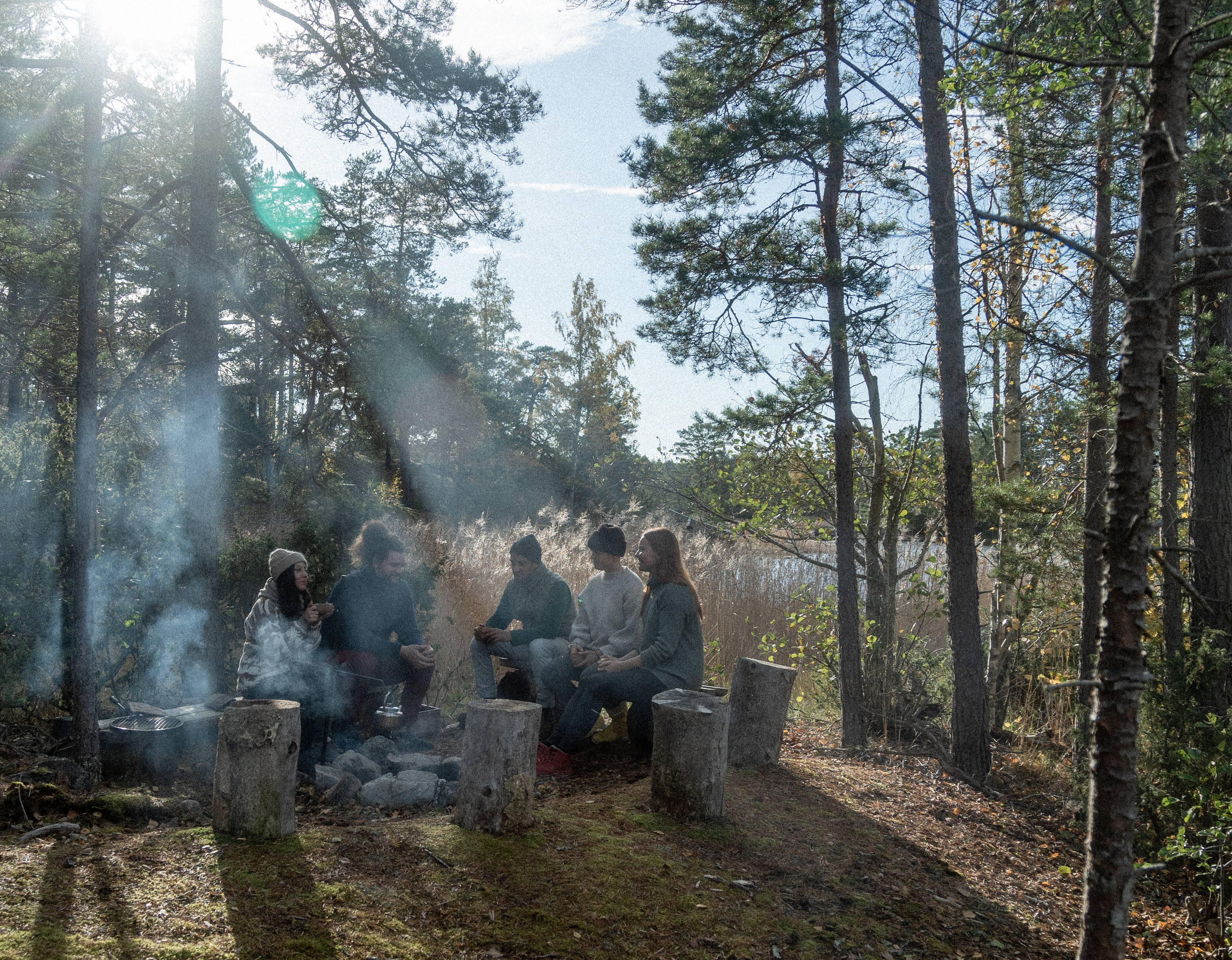 A group of people together in the woods