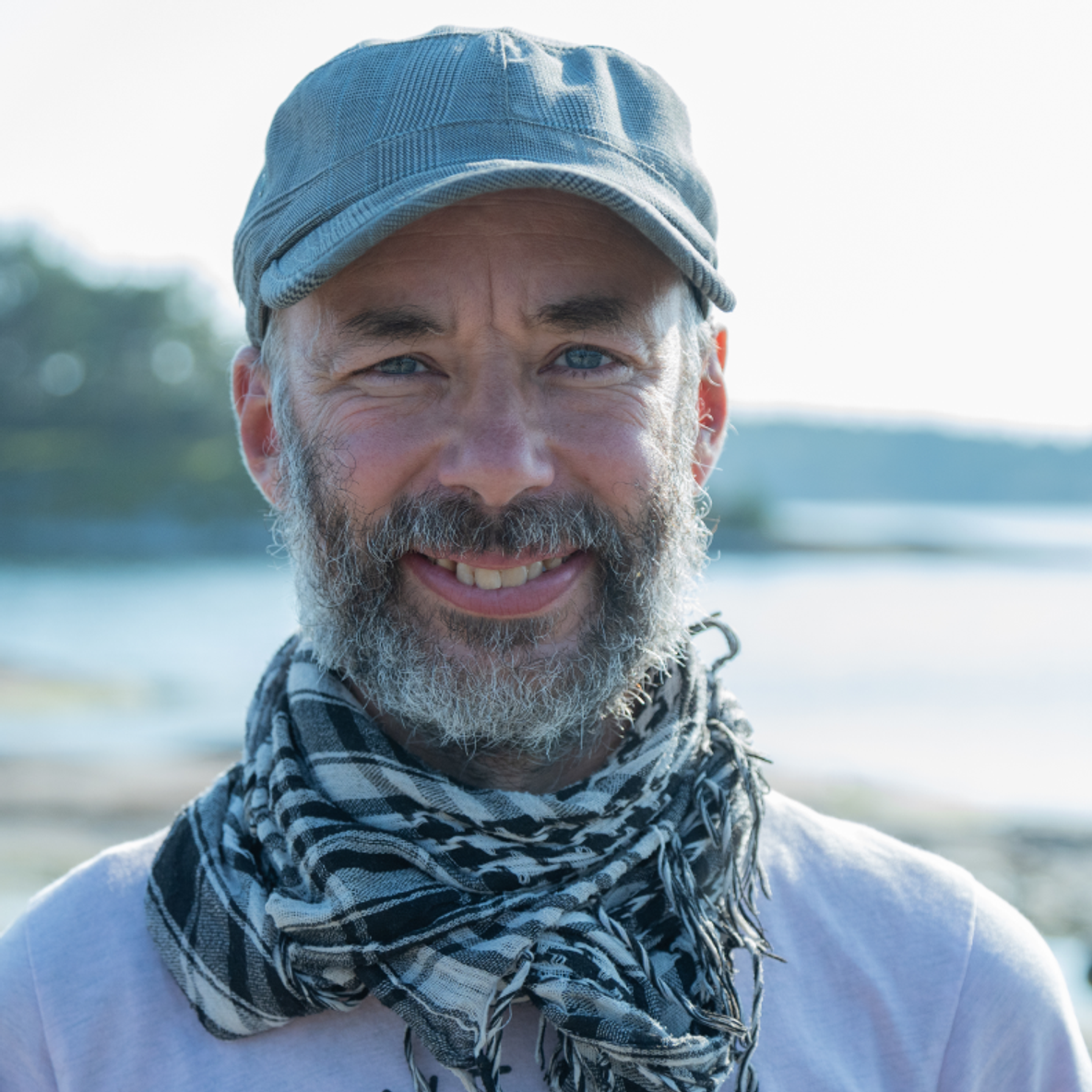 A picture of a happy kayaking instructor in finnish archipelago