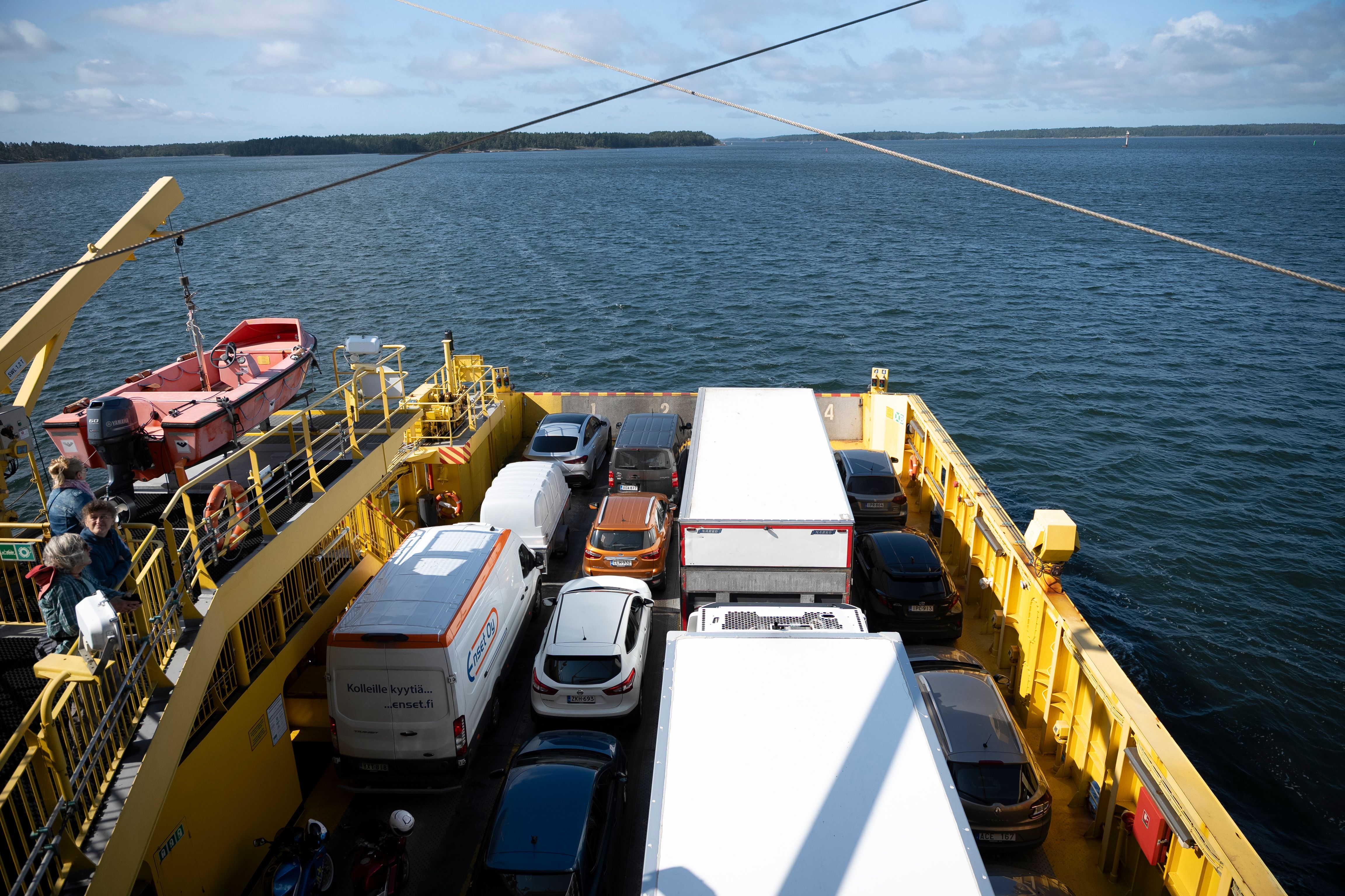 Cars on  yellow ferry