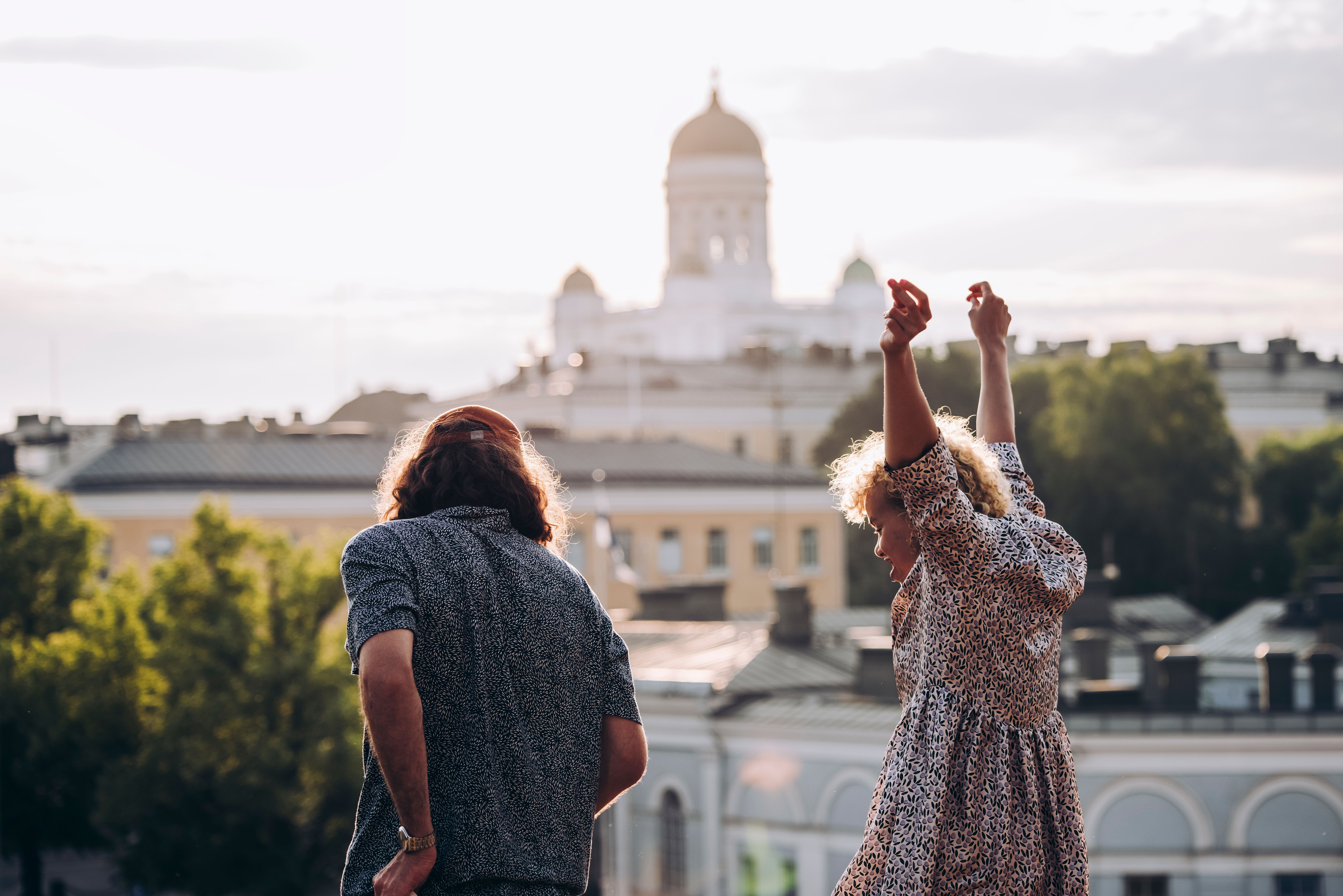 People partying in front of the Helsinki Cathedral.