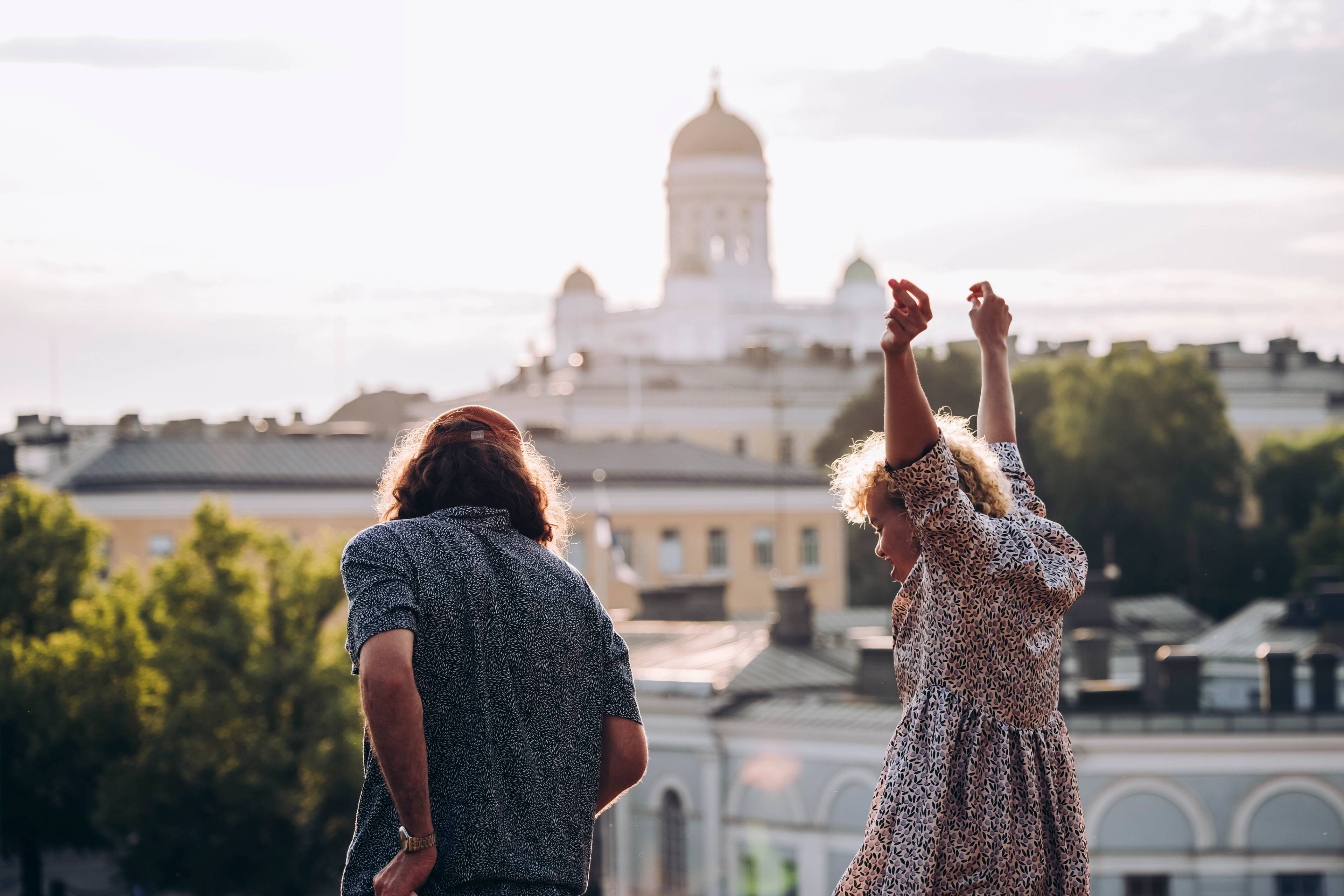 People partying in front of the Helsinki Cathedral.