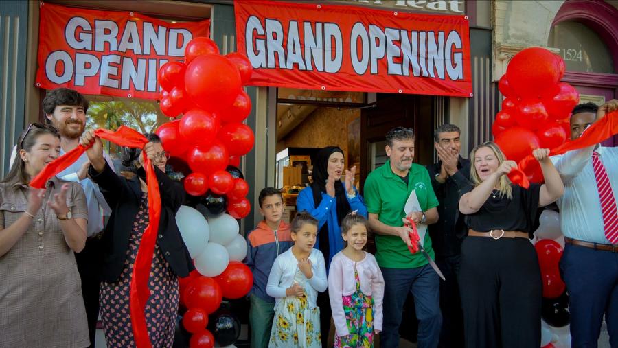 Hebron Market halal butcher Boston grand opening celebration with red balloons and community