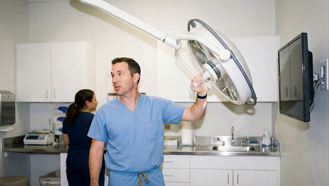 A clinician in a medical exam room