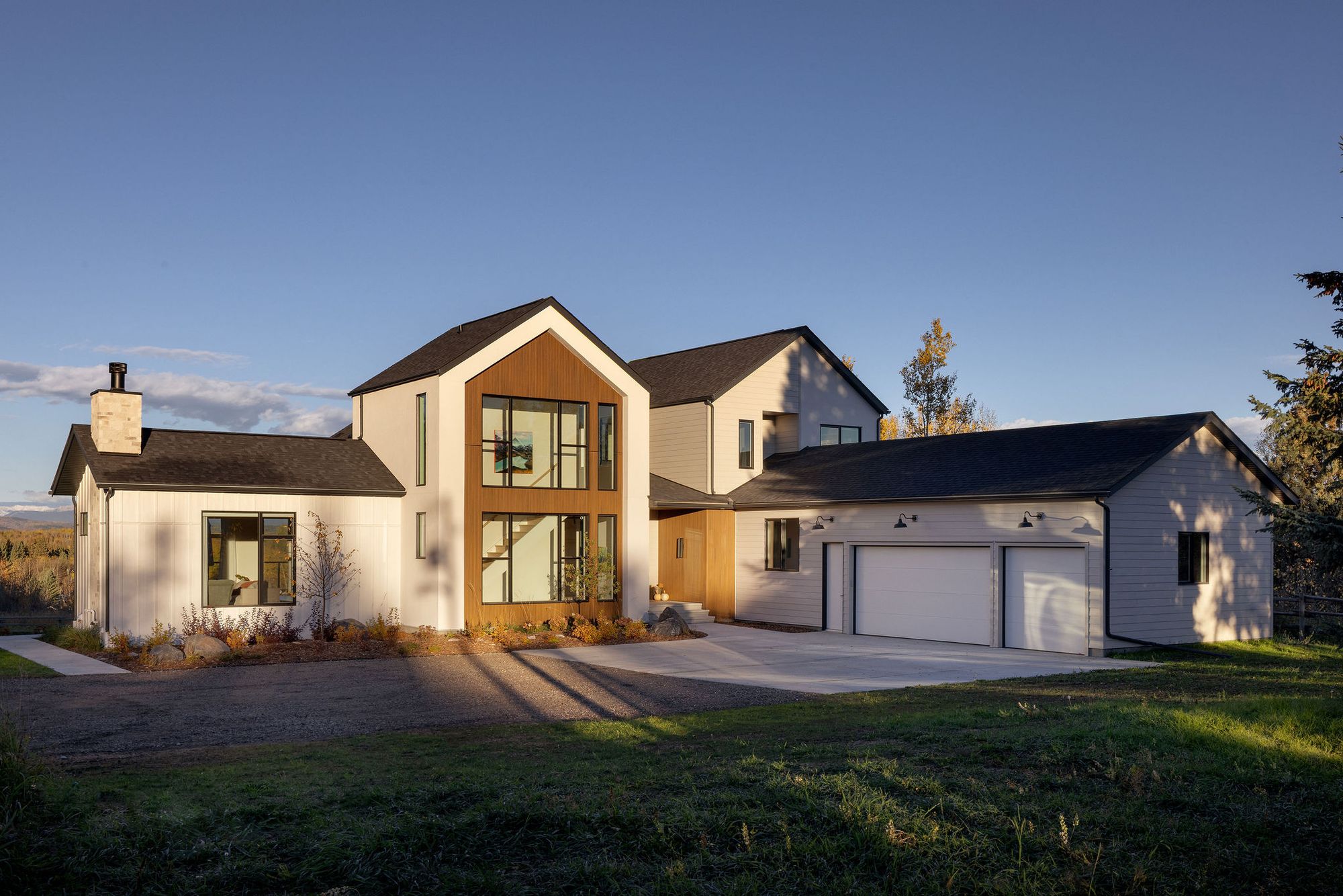 Front exterior of the Priddis home at dusk