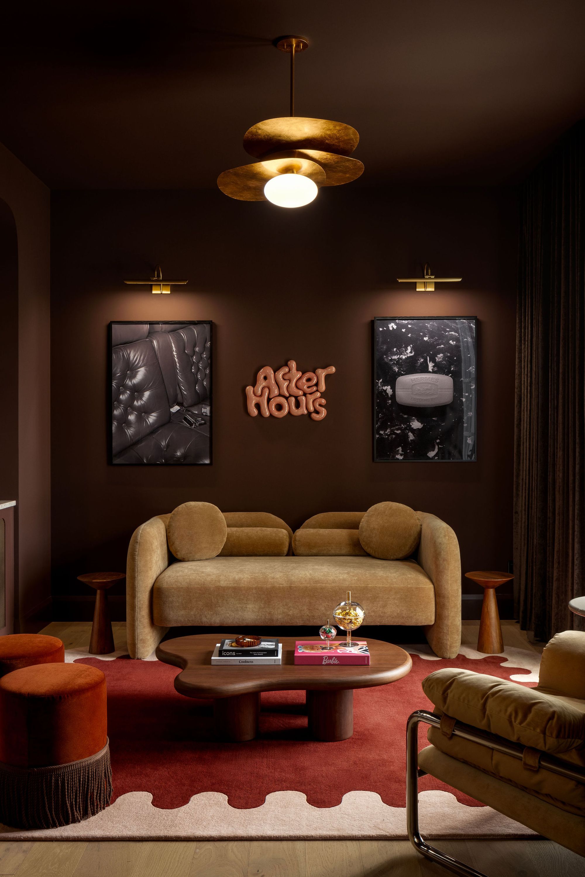 Lounge with sofa and neon sign in The Charlotte home