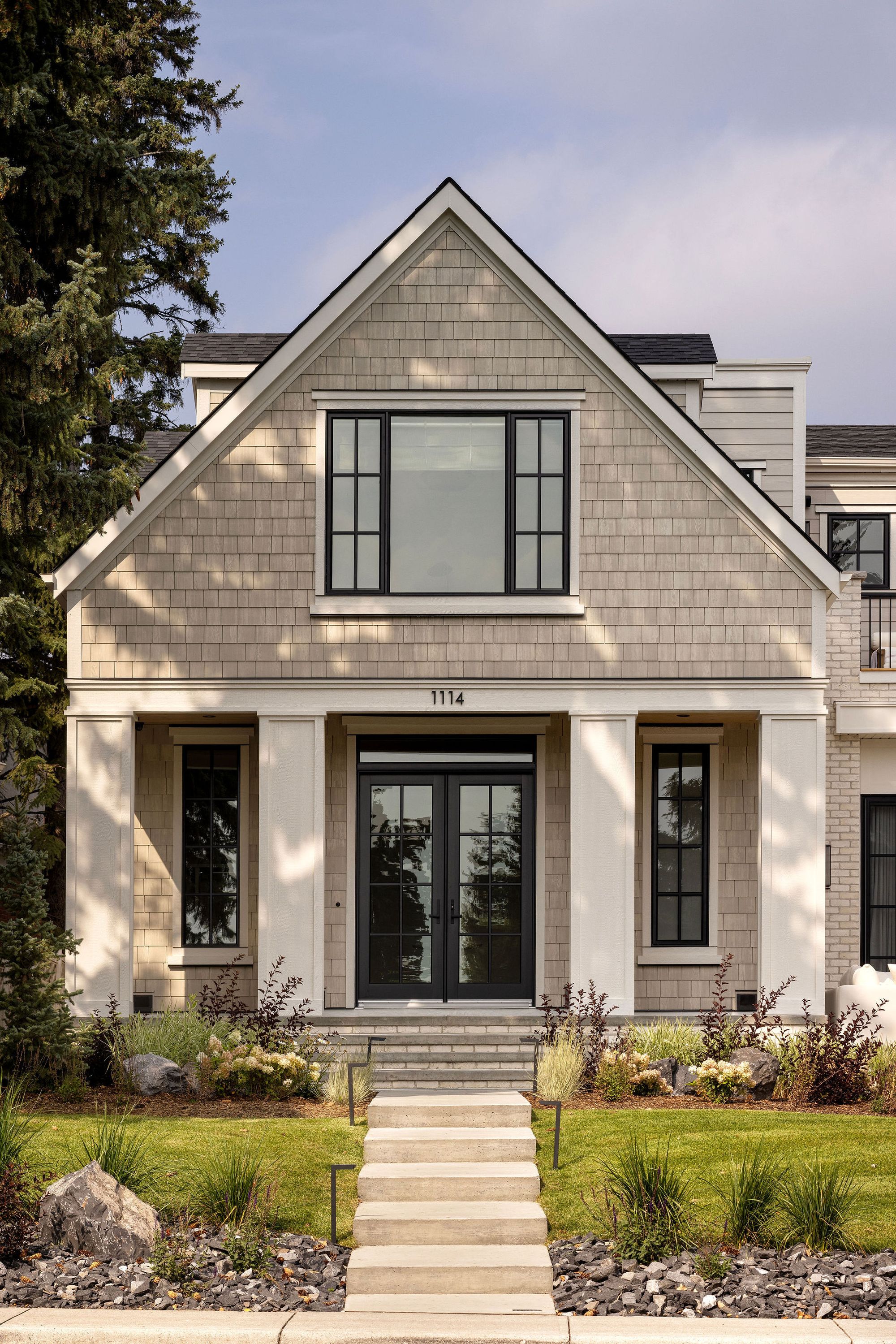 Front entry of The Charlotte home with shingle gable