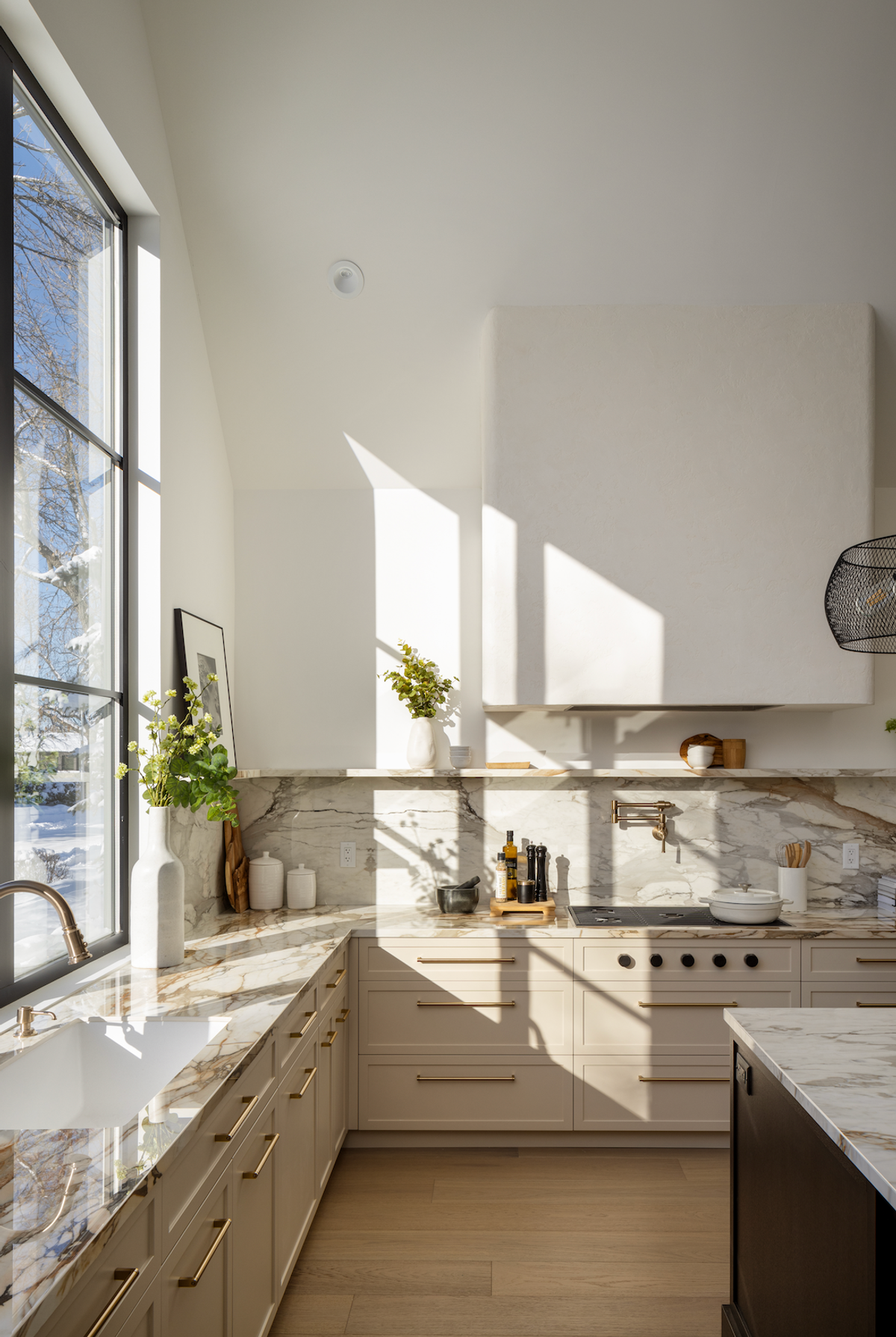 Kitchen with large windows and marble counters
