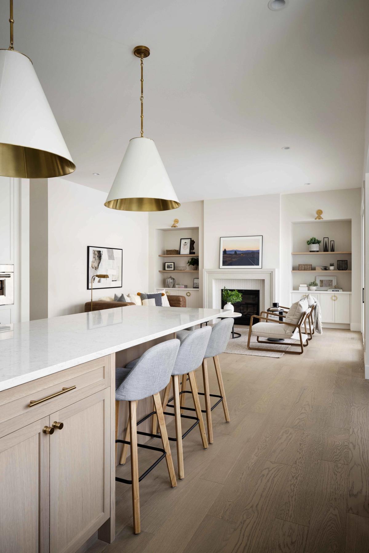 Kitchen island and living area with a fireplace