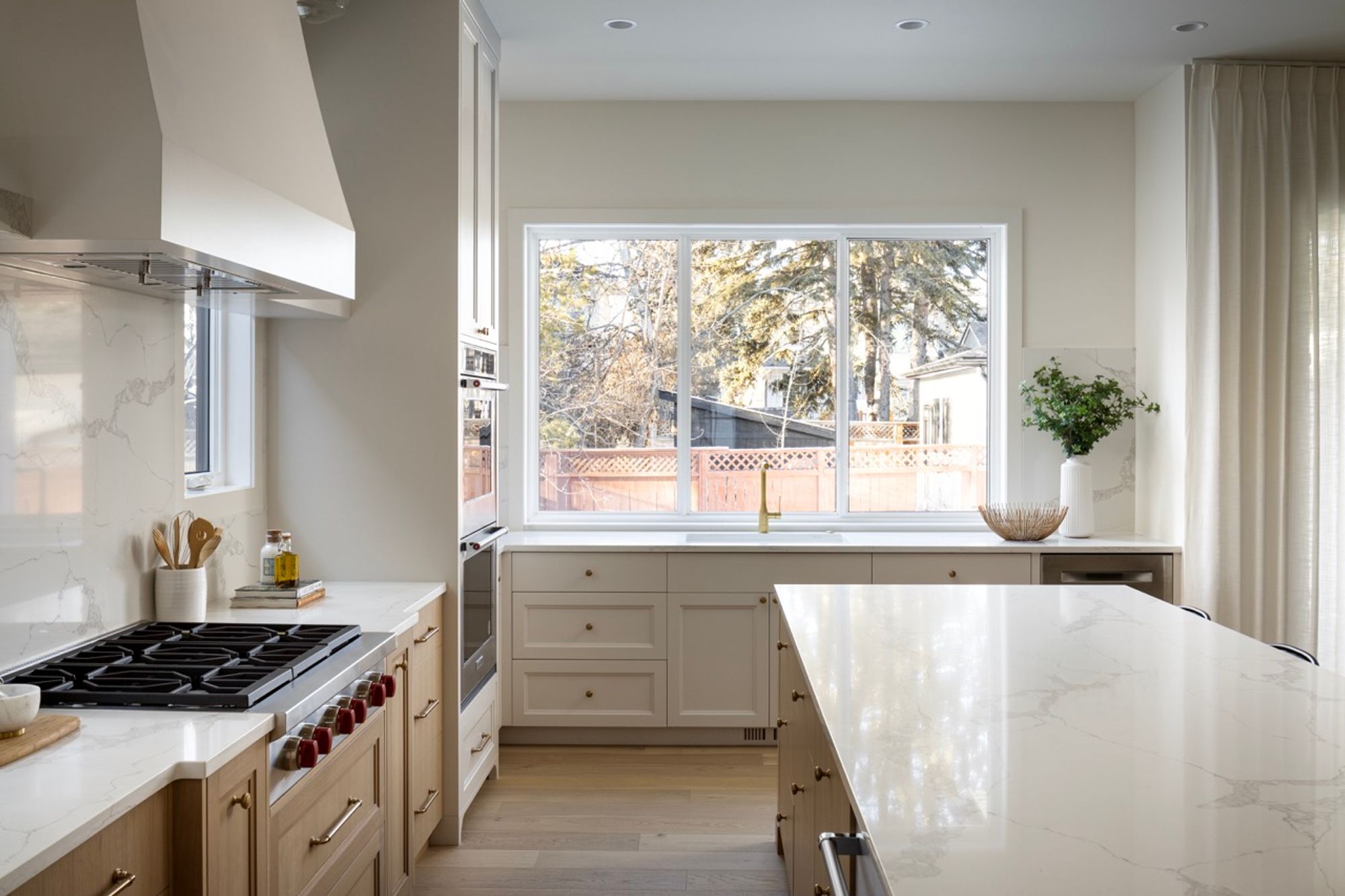 Kitchen with gas range and large window in the Riverdale home