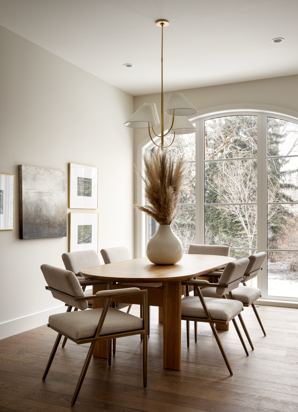 Dining room with oval table and arched window