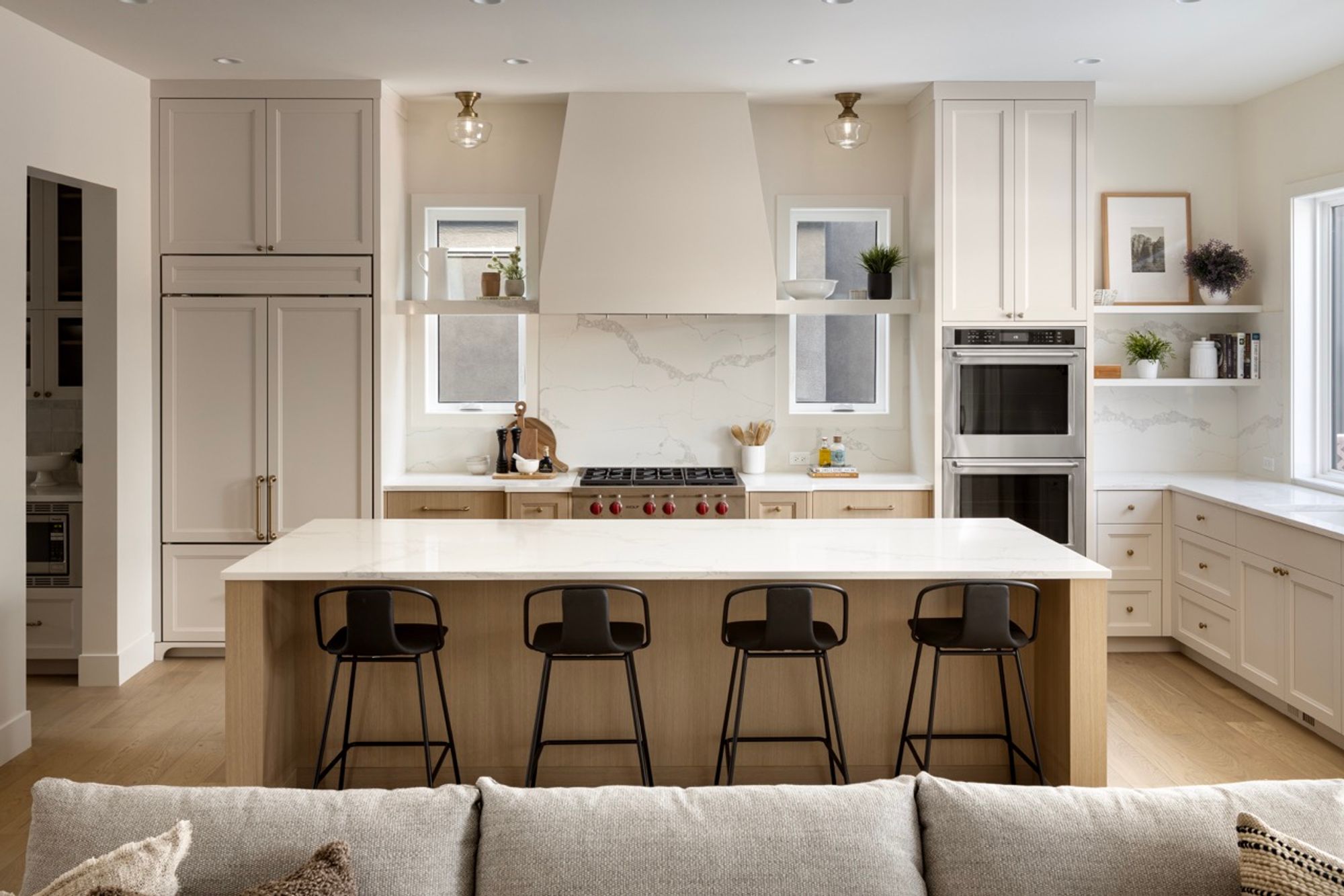 Kitchen island and range wall in the Riverdale home