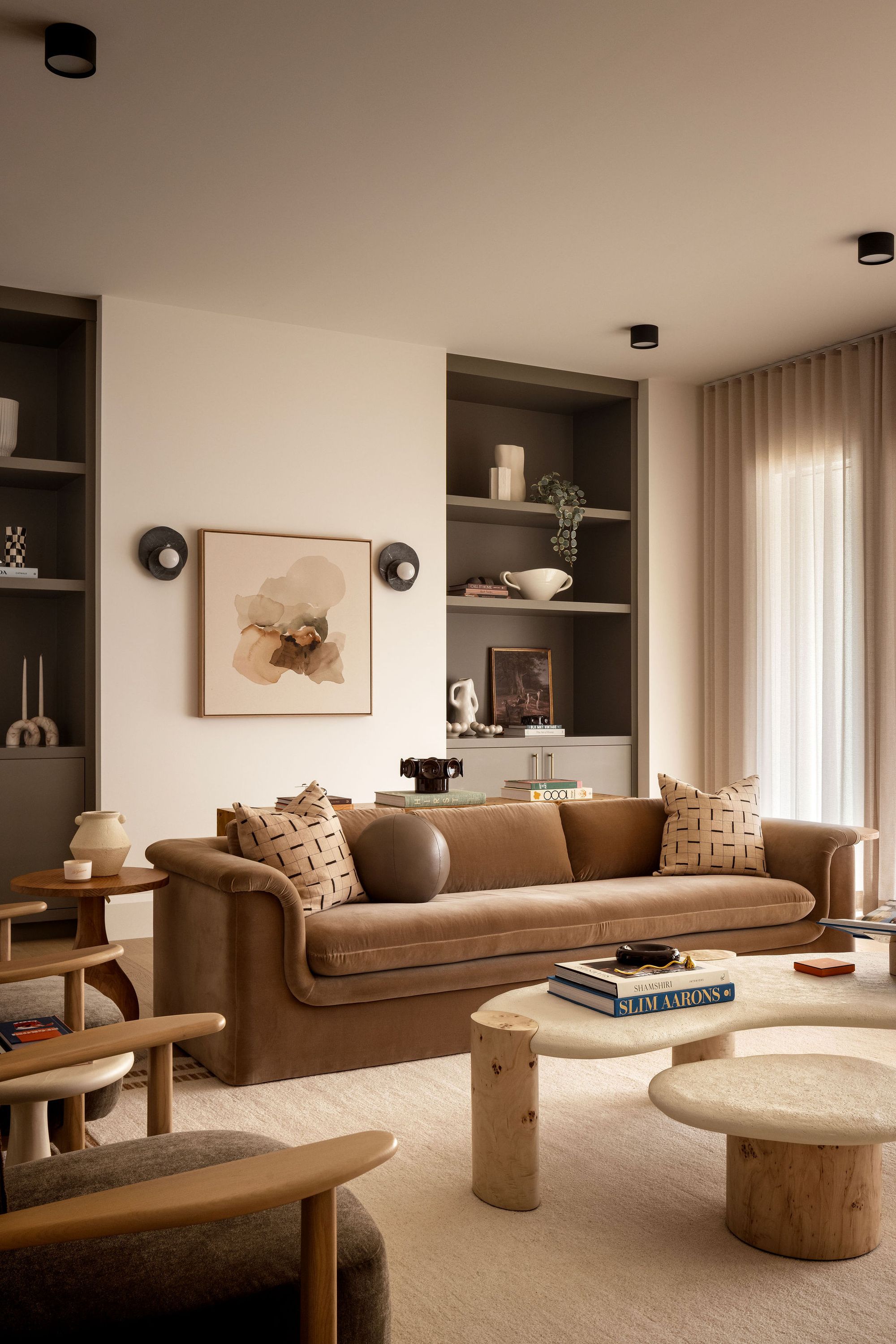 Living room with sofa and built-in shelves in The Charlotte home