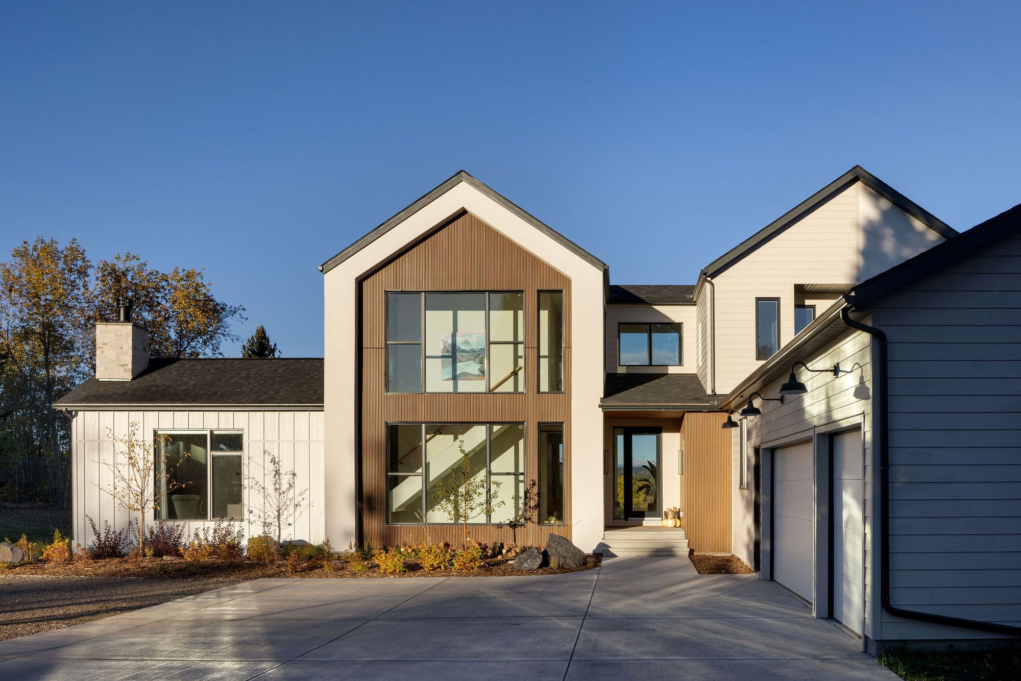Front exterior of the Priddis home with garage