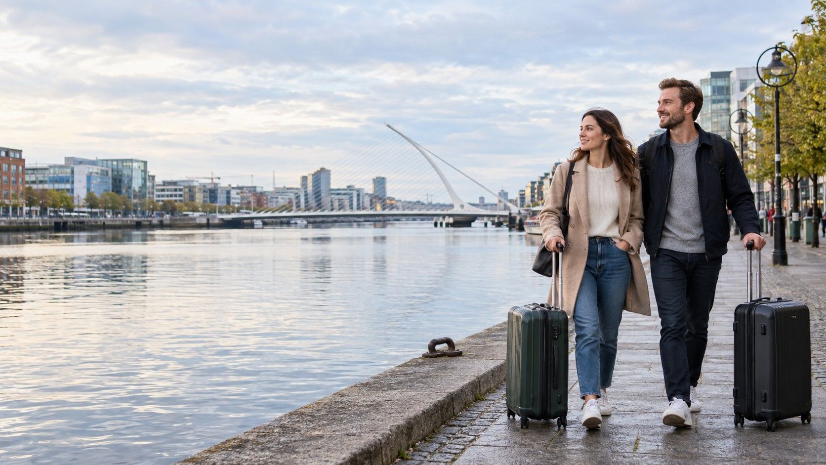 New residents arriving in Dublin with luggage beside the River Liffey