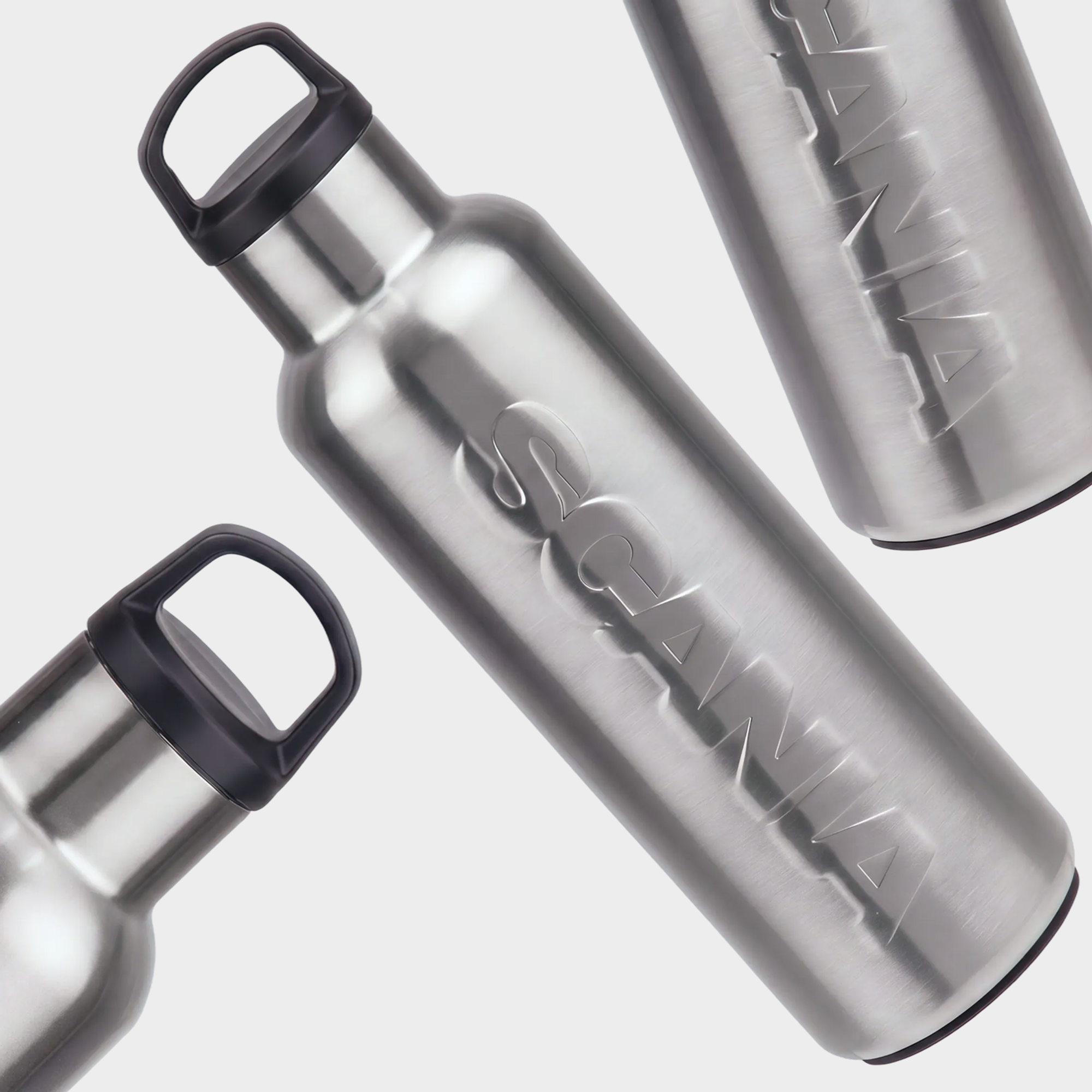 Group of aluminum bottles with Scania logotype.