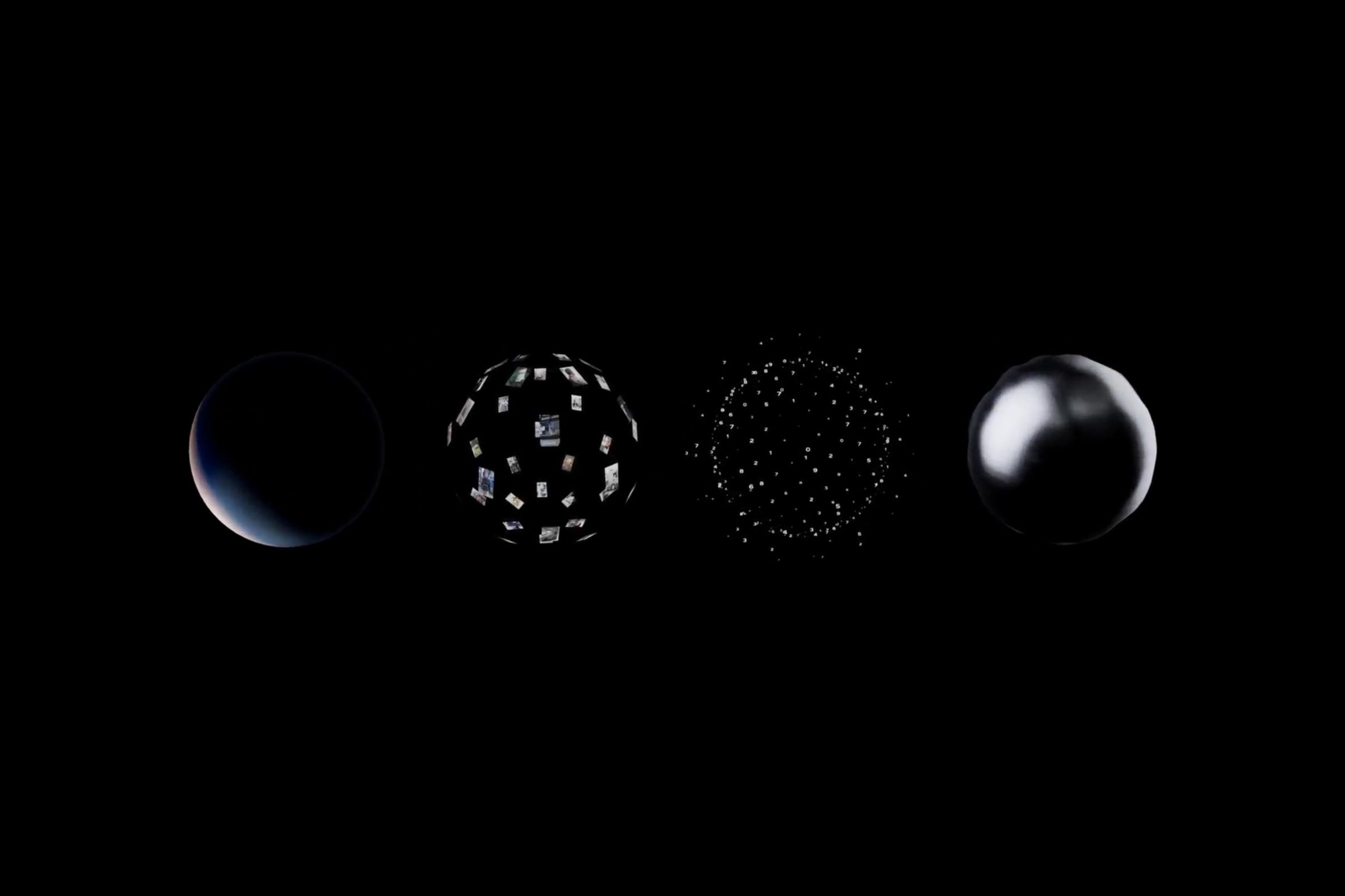 Four globes made of various materials on a black background
