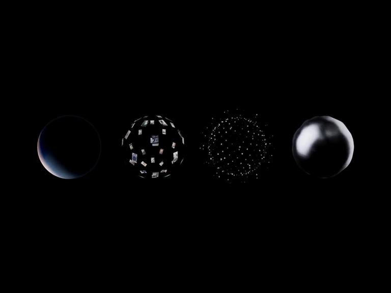Four globes made of various materials on a black background