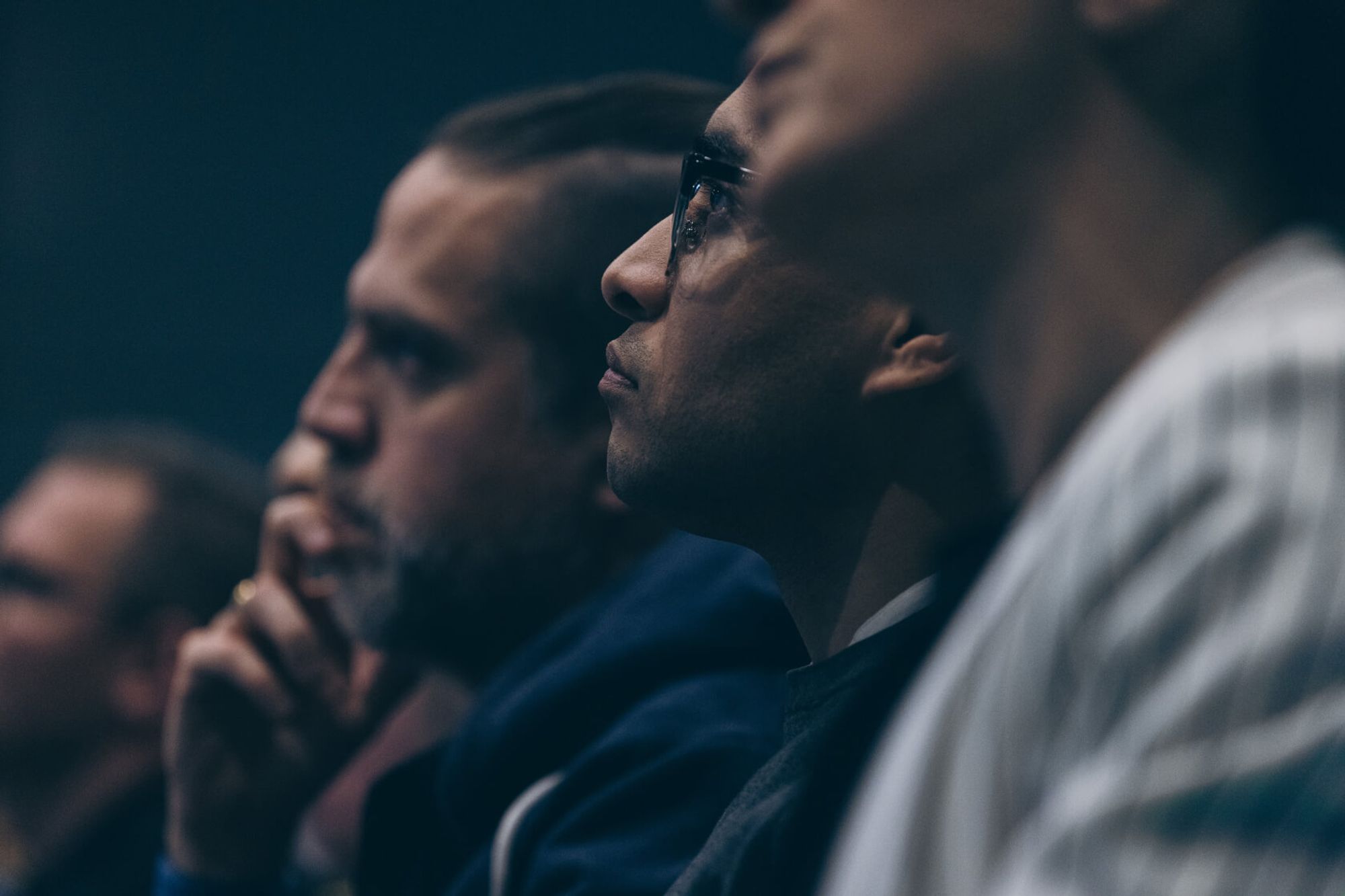 Audience members in profile