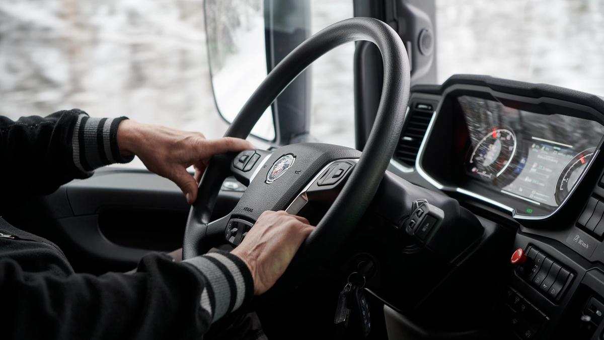 Closeup of driver's hands on a steering wheel
