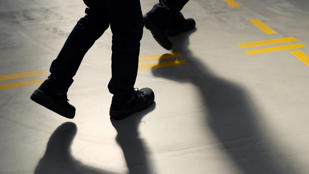 Abstract photo of two people walking