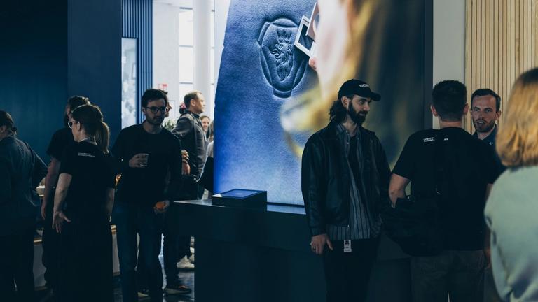 Groups of people chatting during the Scania Experience Meetup