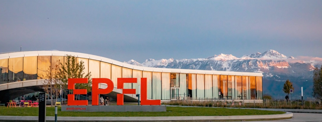 EPFL university campus with mountain backdrop during IMC visit