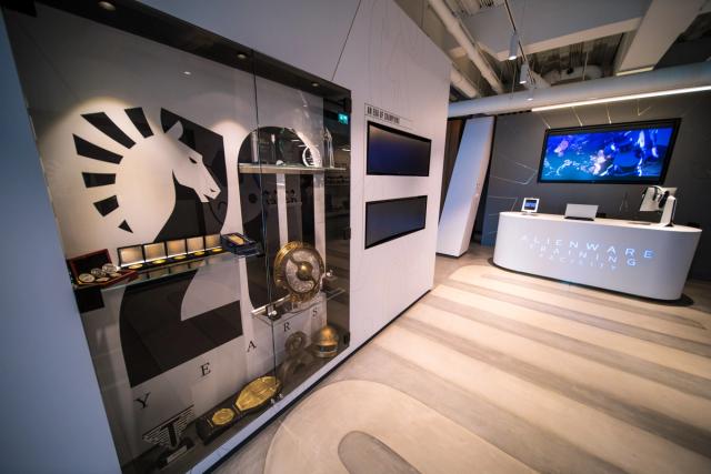 Interior of Team Liquid’s Utrecht office showcasing esports trophies and branding