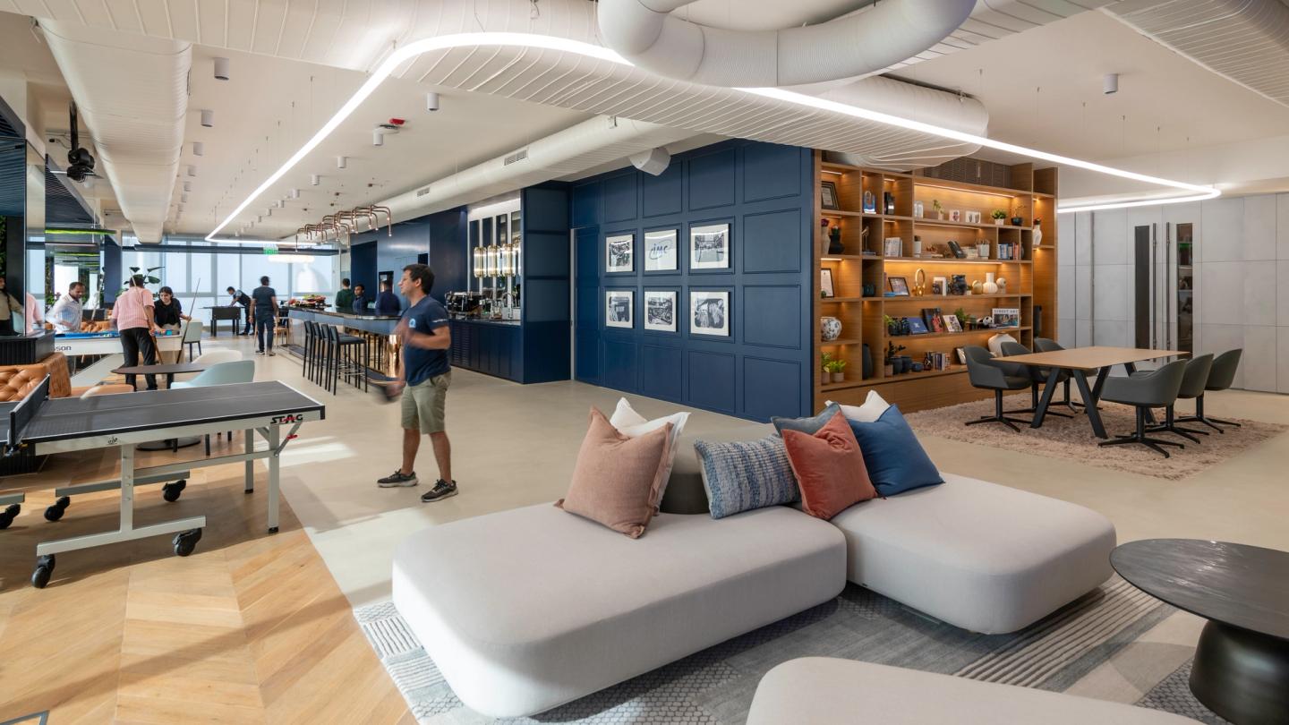 Modern interior of IMC’s new Mumbai office with lounge and recreation areas