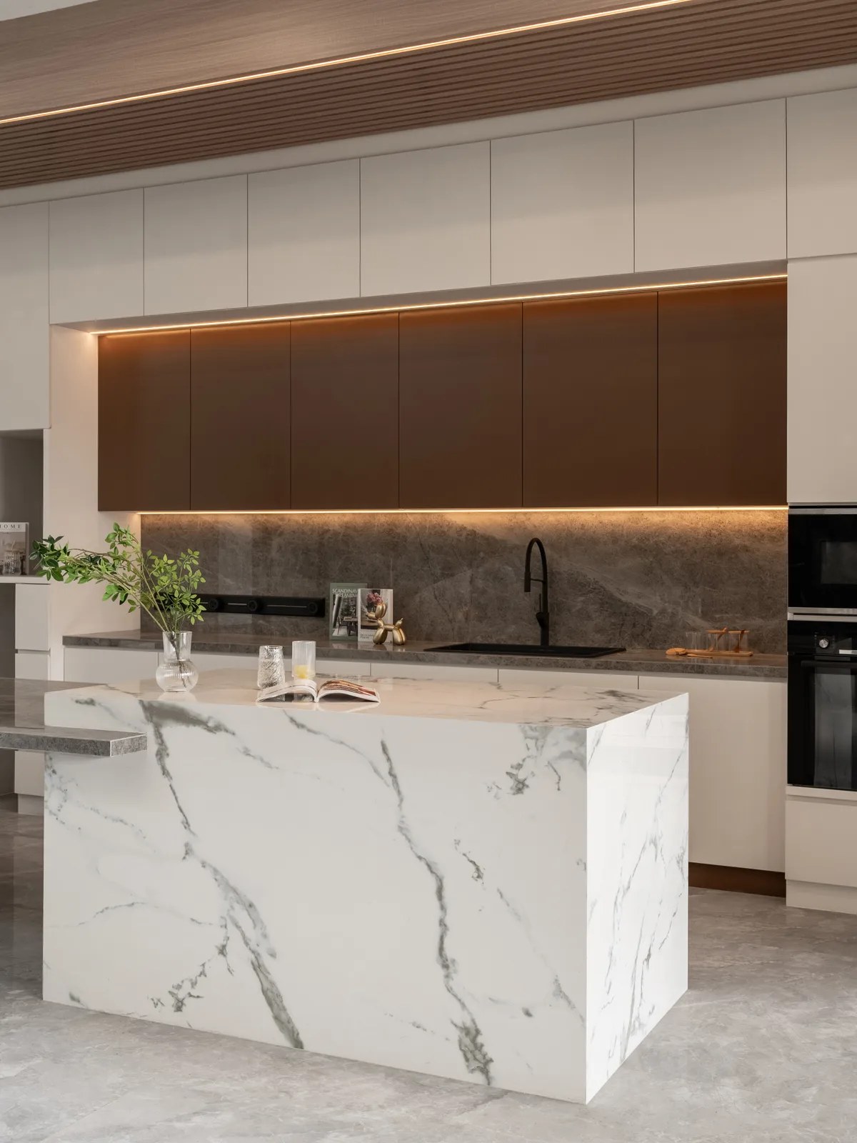 Custom kitchen with a waterfall marble island
