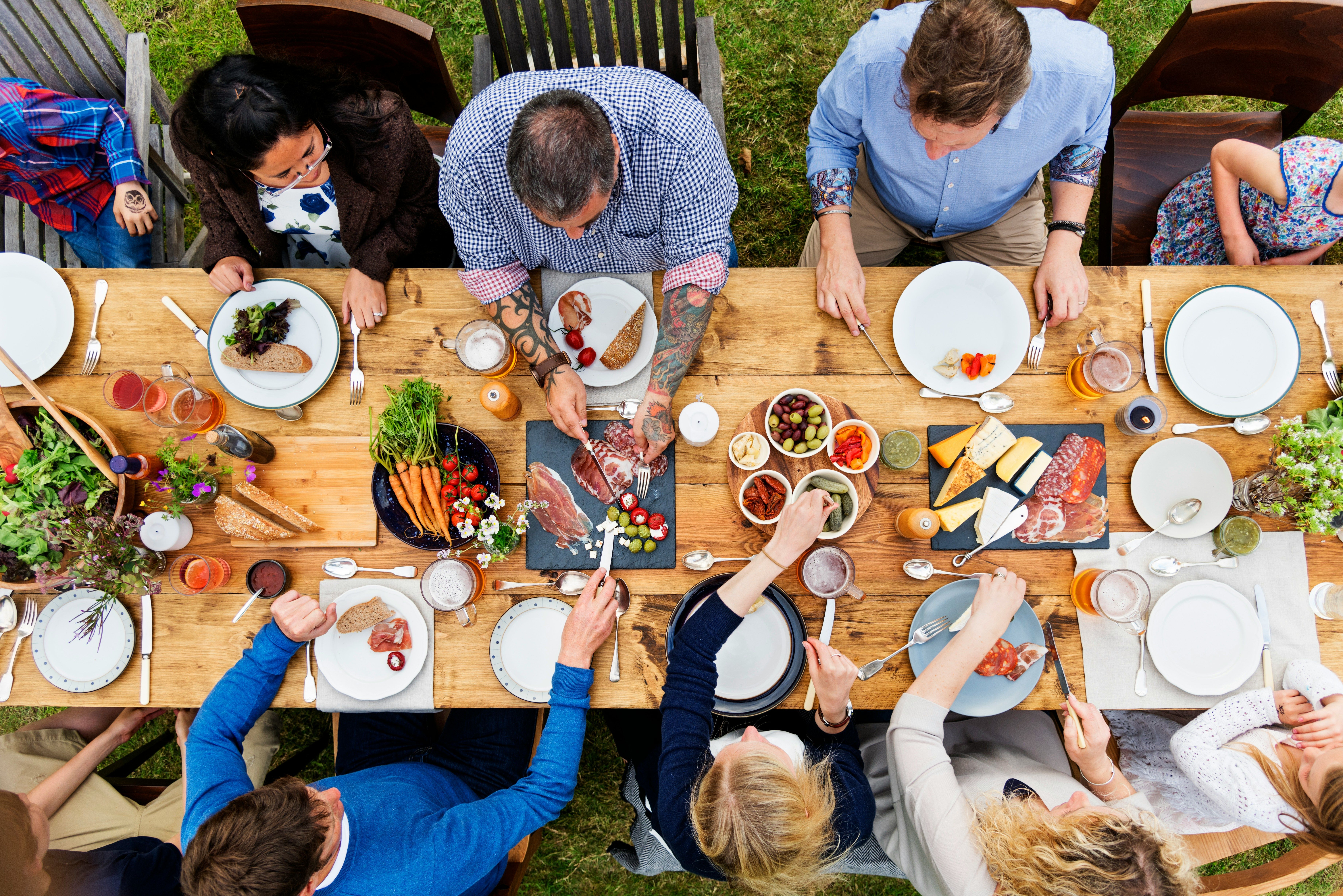 Overhead view of people sharing an outdoor meal at a long wooden table filled with food.​​​​‌﻿‍﻿​‍​‍‌‍﻿﻿‌﻿​‍‌‍‍‌‌‍‌﻿‌‍‍‌‌‍﻿‍​‍​‍​﻿‍‍​‍​‍‌﻿​﻿‌‍​‌‌‍﻿‍‌‍‍‌‌﻿‌​‌﻿‍‌​‍﻿‍‌‍‍‌‌‍﻿﻿​‍​‍​‍﻿​​‍​‍‌‍‍​‌﻿​‍‌‍‌‌‌‍‌‍​‍​‍​﻿‍‍​‍​‍​‍﻿﻿‌﻿​﻿‌﻿‌​‌﻿‌‌‌‍‌​‌‍‍‌‌‍﻿﻿​‍﻿﻿‌‍‍‌‌‍﻿‍‌﻿‌​‌‍‌‌‌‍﻿‍‌﻿‌​​‍﻿﻿‌‍‌‌‌‍‌​‌‍‍‌‌﻿‌​​‍﻿﻿‌‍﻿‌‌‍﻿﻿‌‍‌​‌‍‌‌​﻿﻿‌‌﻿​​‌﻿​‍‌‍‌‌‌﻿​﻿‌‍‌‌‌‍﻿‍‌﻿‌​‌‍​‌‌﻿‌​‌‍‍‌‌‍﻿﻿‌‍﻿‍​﻿‍﻿‌‍‍‌‌‍‌​​﻿﻿‌‌‍​﻿‌‍‌‌‌‍​﻿​﻿​‍‌‍​‌‌‍​‌​﻿‍‌​﻿‌‍​‍﻿‌​﻿‌‌​﻿‌‌​﻿‌﻿​﻿‌﻿​‍﻿‌​﻿‌​​﻿‍​​﻿‌​​﻿​‍​‍﻿‌‌‍​‍‌‍‌​​﻿‍‌‌‍​﻿​‍﻿‌‌‍‌‍​﻿​​​﻿​‍‌‍‌​‌‍‌​​﻿‌﻿​﻿‌‌​﻿​‍​﻿​‌​﻿‌​​﻿​​​﻿‍‌​﻿‍﻿‌﻿‌​‌﻿‍‌‌﻿​​‌‍‌‌​﻿﻿‌‌﻿​​‌‍﻿﻿‌﻿​﻿‌﻿‌​​﻿‍﻿‌﻿​​‌‍​‌‌﻿‌​‌‍‍​​﻿﻿‌‌‍​﻿‌‍﻿﻿‌﻿‌‍‌‍‌‌‌﻿​‍‌​‍‌‌‍﻿‌‌‍​‌‌‍‌﻿‌‍‌‌​‍﻿‍‌‍​‌‌‍﻿​‌﻿‌​​﻿﻿﻿‌‍​‍‌‍​‌‌﻿​﻿‌‍‌‌‌‌‌‌‌﻿​‍‌‍﻿​​﻿﻿‌​‍‌‌​﻿​‍‌​‌‍‌﻿​﻿‌﻿‌​‌﻿‌‌‌‍‌​‌‍‍‌‌‍﻿﻿​‍‌‍‌‍‍‌‌‍‌​​﻿﻿‌‌‍​﻿‌‍‌‌‌‍​﻿​﻿​‍‌‍​‌‌‍​‌​﻿‍‌​﻿‌‍​‍﻿‌​﻿‌‌​﻿‌‌​﻿‌﻿​﻿‌﻿​‍﻿‌​﻿‌​​﻿‍​​﻿‌​​﻿​‍​‍﻿‌‌‍​‍‌‍‌​​﻿‍‌‌‍​﻿​‍﻿‌‌‍‌‍​﻿​​​﻿​‍‌‍‌​‌‍‌​​﻿‌﻿​﻿‌‌​﻿​‍​﻿​‌​﻿‌​​﻿​​​﻿‍‌​‍‌‍‌﻿‌​‌﻿‍‌‌﻿​​‌‍‌‌​﻿﻿‌‌﻿​​‌‍﻿﻿‌﻿​﻿‌﻿‌​​‍‌‍‌﻿​​‌‍​‌‌﻿‌​‌‍‍​​﻿﻿‌‌‍​﻿‌‍﻿﻿‌﻿‌‍‌‍‌‌‌﻿​‍‌​‍‌‌‍﻿‌‌‍​‌‌‍‌﻿‌‍‌‌​‍﻿‍‌‍​‌‌‍﻿​‌﻿‌​​‍‌‍‌﻿​​‌‍‌‌‌﻿​‍‌﻿​﻿‌﻿​​‌‍‌‌‌‍​﻿‌﻿‌​‌‍‍‌‌﻿‌‍‌‍‌‌​﻿﻿‌‌﻿​​‌﻿‌‌‌‍​‍‌‍﻿​‌‍‍‌‌﻿​﻿‌‍‍​‌‍‌‌‌‍‌​​‍​‍‌﻿﻿‌