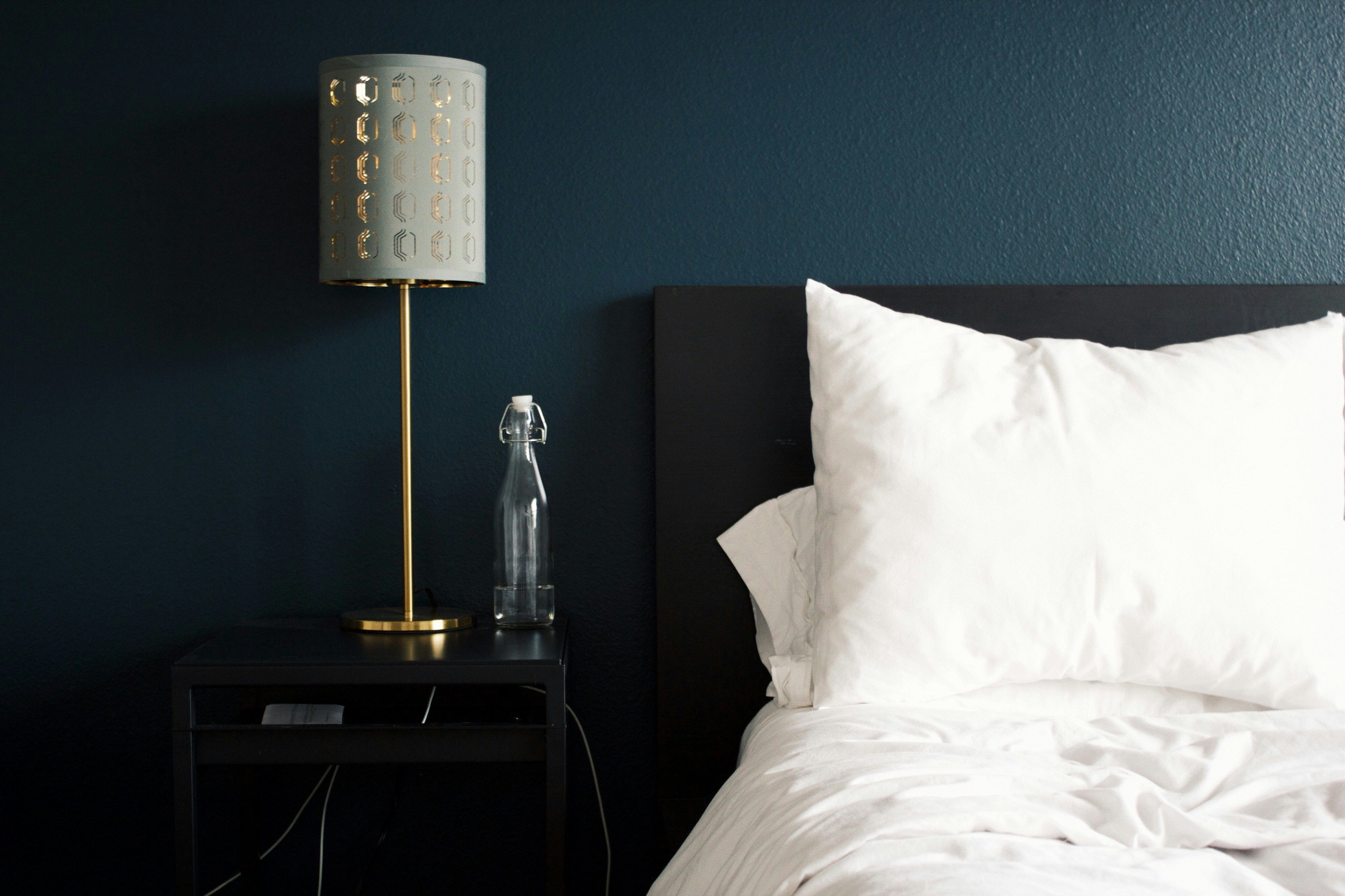 Brass lamp on a nightstand, white bed, and dark blue wall in a modern bedroom.​​​​‌﻿‍﻿​‍​‍‌‍﻿﻿‌﻿​‍‌‍‍‌‌‍‌﻿‌‍‍‌‌‍﻿‍​‍​‍​﻿‍‍​‍​‍‌﻿​﻿‌‍​‌‌‍﻿‍‌‍‍‌‌﻿‌​‌﻿‍‌​‍﻿‍‌‍‍‌‌‍﻿﻿​‍​‍​‍﻿​​‍​‍‌‍‍​‌﻿​‍‌‍‌‌‌‍‌‍​‍​‍​﻿‍‍​‍​‍​‍﻿﻿‌﻿​﻿‌﻿‌​‌﻿‌‌‌‍‌​‌‍‍‌‌‍﻿﻿​‍﻿﻿‌‍‍‌‌‍﻿‍‌﻿‌​‌‍‌‌‌‍﻿‍‌﻿‌​​‍﻿﻿‌‍‌‌‌‍‌​‌‍‍‌‌﻿‌​​‍﻿﻿‌‍﻿‌‌‍﻿﻿‌‍‌​‌‍‌‌​﻿﻿‌‌﻿​​‌﻿​‍‌‍‌‌‌﻿​﻿‌‍‌‌‌‍﻿‍‌﻿‌​‌‍​‌‌﻿‌​‌‍‍‌‌‍﻿﻿‌‍﻿‍​﻿‍﻿‌‍‍‌‌‍‌​​﻿﻿‌​﻿‌‌‌‍‌‍​﻿‌​​﻿​​‌‍​‌​﻿​﻿​﻿‍‌​﻿‌​​‍﻿‌​﻿‌‌​﻿​‍​﻿​﻿​﻿‌​​‍﻿‌​﻿‌​​﻿​﻿‌‍​‍​﻿​﻿​‍﻿‌​﻿‍‌​﻿‍​​﻿‌‍​﻿​﻿​‍﻿‌‌‍‌​​﻿‌‍‌‍‌‌​﻿​​​﻿‌‍​﻿‌‌‌‍​‌​﻿​​‌‍​‌​﻿‌​​﻿‍​‌‍​‍​﻿‍﻿‌﻿‌​‌﻿‍‌‌﻿​​‌‍‌‌​﻿﻿‌‌﻿​​‌‍﻿﻿‌﻿​﻿‌﻿‌​​﻿‍﻿‌﻿​​‌‍​‌‌﻿‌​‌‍‍​​﻿﻿‌‌‍​﻿‌‍﻿﻿‌﻿‌‍‌‍‌‌‌﻿​‍‌​‍‌‌‍﻿‌‌‍​‌‌‍‌﻿‌‍‌‌​‍﻿‍‌‍​‌‌‍﻿​‌﻿‌​​﻿﻿﻿‌‍​‍‌‍​‌‌﻿​﻿‌‍‌‌‌‌‌‌‌﻿​‍‌‍﻿​​﻿﻿‌​‍‌‌​﻿​‍‌​‌‍‌﻿​﻿‌﻿‌​‌﻿‌‌‌‍‌​‌‍‍‌‌‍﻿﻿​‍‌‍‌‍‍‌‌‍‌​​﻿﻿‌​﻿‌‌‌‍‌‍​﻿‌​​﻿​​‌‍​‌​﻿​﻿​﻿‍‌​﻿‌​​‍﻿‌​﻿‌‌​﻿​‍​﻿​﻿​﻿‌​​‍﻿‌​﻿‌​​﻿​﻿‌‍​‍​﻿​﻿​‍﻿‌​﻿‍‌​﻿‍​​﻿‌‍​﻿​﻿​‍﻿‌‌‍‌​​﻿‌‍‌‍‌‌​﻿​​​﻿‌‍​﻿‌‌‌‍​‌​﻿​​‌‍​‌​﻿‌​​﻿‍​‌‍​‍​‍‌‍‌﻿‌​‌﻿‍‌‌﻿​​‌‍‌‌​﻿﻿‌‌﻿​​‌‍﻿﻿‌﻿​﻿‌﻿‌​​‍‌‍‌﻿​​‌‍​‌‌﻿‌​‌‍‍​​﻿﻿‌‌‍​﻿‌‍﻿﻿‌﻿‌‍‌‍‌‌‌﻿​‍‌​‍‌‌‍﻿‌‌‍​‌‌‍‌﻿‌‍‌‌​‍﻿‍‌‍​‌‌‍﻿​‌﻿‌​​‍‌‍‌﻿​​‌‍‌‌‌﻿​‍‌﻿​﻿‌﻿​​‌‍‌‌‌‍​﻿‌﻿‌​‌‍‍‌‌﻿‌‍‌‍‌‌​﻿﻿‌‌﻿​​‌﻿‌‌‌‍​‍‌‍﻿​‌‍‍‌‌﻿​﻿‌‍‍​‌‍‌‌‌‍‌​​‍​‍‌﻿﻿‌