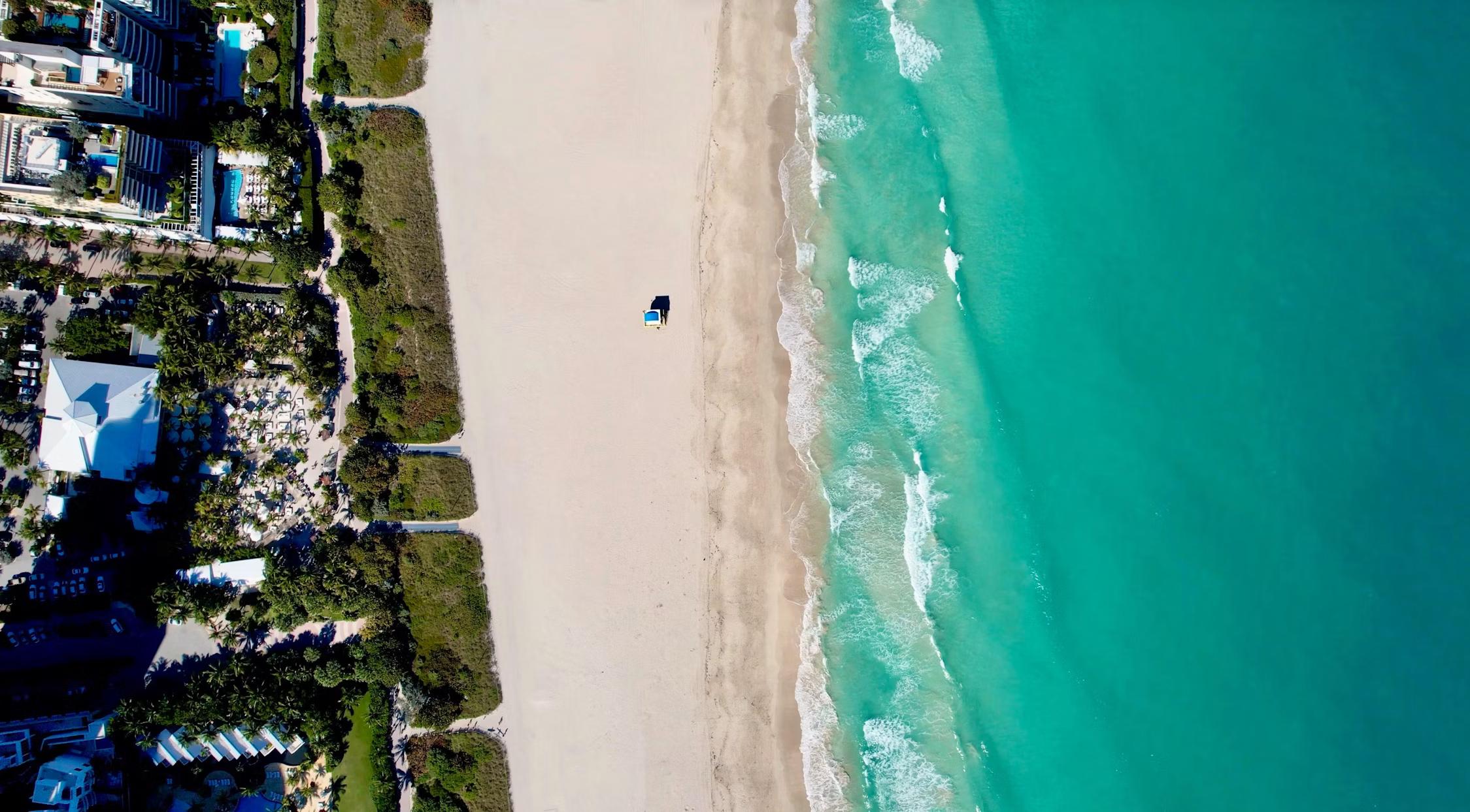 Aerial view of a white sand beach, turquoise ocean with waves, a single beach umbrella, and a coastal city.​​​​‌﻿‍﻿​‍​‍‌‍﻿﻿‌﻿​‍‌‍‍‌‌‍‌﻿‌‍‍‌‌‍﻿‍​‍​‍​﻿‍‍​‍​‍‌﻿​﻿‌‍​‌‌‍﻿‍‌‍‍‌‌﻿‌​‌﻿‍‌​‍﻿‍‌‍‍‌‌‍﻿﻿​‍​‍​‍﻿​​‍​‍‌‍‍​‌﻿​‍‌‍‌‌‌‍‌‍​‍​‍​﻿‍‍​‍​‍​‍﻿﻿‌﻿​﻿‌﻿‌​‌﻿‌‌‌‍‌​‌‍‍‌‌‍﻿﻿​‍﻿﻿‌‍‍‌‌‍﻿‍‌﻿‌​‌‍‌‌‌‍﻿‍‌﻿‌​​‍﻿﻿‌‍‌‌‌‍‌​‌‍‍‌‌﻿‌​​‍﻿﻿‌‍﻿‌‌‍﻿﻿‌‍‌​‌‍‌‌​﻿﻿‌‌﻿​​‌﻿​‍‌‍‌‌‌﻿​﻿‌‍‌‌‌‍﻿‍‌﻿‌​‌‍​‌‌﻿‌​‌‍‍‌‌‍﻿﻿‌‍﻿‍​﻿‍﻿‌‍‍‌‌‍‌​​﻿﻿‌‌‍​‌‌‍‌‍​﻿​﻿​﻿‍‌‌‍​﻿‌‍‌‌​﻿​﻿‌‍‌‌​‍﻿‌​﻿​​​﻿‌​​﻿‍​​﻿‌​​‍﻿‌​﻿‌​‌‍‌‌​﻿‌‌‌‍‌​​‍﻿‌‌‍​‍​﻿‌​​﻿‍‌​﻿‌‌​‍﻿‌‌‍​‌​﻿​‍​﻿​‍‌‍​﻿​﻿​​​﻿‌‍​﻿‌﻿​﻿‌​​﻿​‍‌‍​‍‌‍​‌​﻿​‍​﻿‍﻿‌﻿‌​‌﻿‍‌‌﻿​​‌‍‌‌​﻿﻿‌‌﻿​​‌‍﻿﻿‌﻿​﻿‌﻿‌​​﻿‍﻿‌﻿​​‌‍​‌‌﻿‌​‌‍‍​​﻿﻿‌‌‍​﻿‌‍﻿﻿‌﻿‌‍‌‍‌‌‌﻿​‍‌​‍‌‌‍﻿‌‌‍​‌‌‍‌﻿‌‍‌‌​‍﻿‍‌‍​‌‌‍﻿​‌﻿‌​​﻿﻿﻿‌‍​‍‌‍​‌‌﻿​﻿‌‍‌‌‌‌‌‌‌﻿​‍‌‍﻿​​﻿﻿‌​‍‌‌​﻿​‍‌​‌‍‌﻿​﻿‌﻿‌​‌﻿‌‌‌‍‌​‌‍‍‌‌‍﻿﻿​‍‌‍‌‍‍‌‌‍‌​​﻿﻿‌‌‍​‌‌‍‌‍​﻿​﻿​﻿‍‌‌‍​﻿‌‍‌‌​﻿​﻿‌‍‌‌​‍﻿‌​﻿​​​﻿‌​​﻿‍​​﻿‌​​‍﻿‌​﻿‌​‌‍‌‌​﻿‌‌‌‍‌​​‍﻿‌‌‍​‍​﻿‌​​﻿‍‌​﻿‌‌​‍﻿‌‌‍​‌​﻿​‍​﻿​‍‌‍​﻿​﻿​​​﻿‌‍​﻿‌﻿​﻿‌​​﻿​‍‌‍​‍‌‍​‌​﻿​‍​‍‌‍‌﻿‌​‌﻿‍‌‌﻿​​‌‍‌‌​﻿﻿‌‌﻿​​‌‍﻿﻿‌﻿​﻿‌﻿‌​​‍‌‍‌﻿​​‌‍​‌‌﻿‌​‌‍‍​​﻿﻿‌‌‍​﻿‌‍﻿﻿‌﻿‌‍‌‍‌‌‌﻿​‍‌​‍‌‌‍﻿‌‌‍​‌‌‍‌﻿‌‍‌‌​‍﻿‍‌‍​‌‌‍﻿​‌﻿‌​​‍‌‍‌﻿​​‌‍‌‌‌﻿​‍‌﻿​﻿‌﻿​​‌‍‌‌‌‍​﻿‌﻿‌​‌‍‍‌‌﻿‌‍‌‍‌‌​﻿﻿‌‌﻿​​‌﻿‌‌‌‍​‍‌‍﻿​‌‍‍‌‌﻿​﻿‌‍‍​‌‍‌‌‌‍‌​​‍​‍‌﻿﻿‌