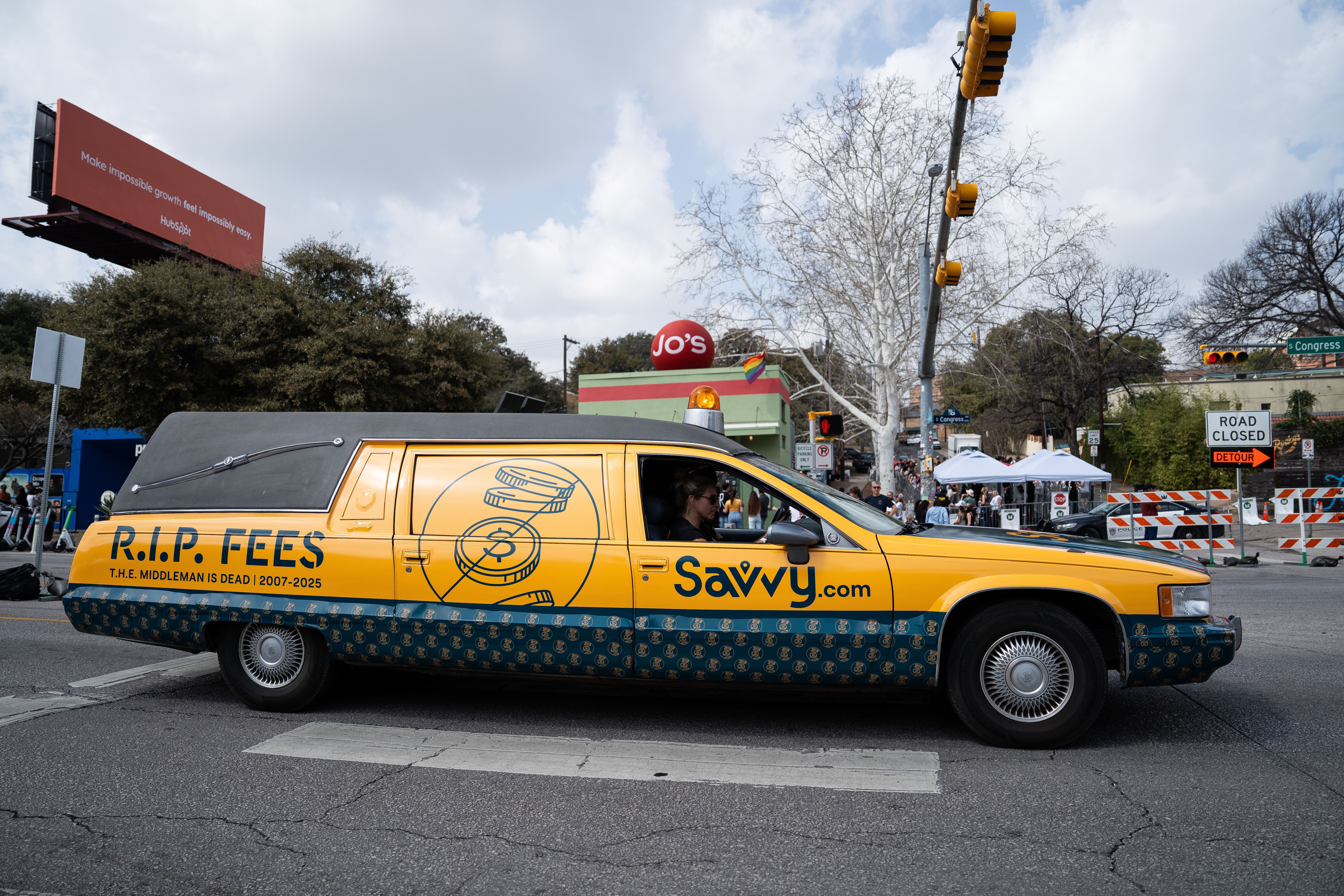 Yellow and patterned dark blue hearse with "R.I.P. FEES" and "Savvy.com" on its side, showing a hand dropping a coin.​​​​‌﻿‍﻿​‍​‍‌‍﻿﻿‌﻿​‍‌‍‍‌‌‍‌﻿‌‍‍‌‌‍﻿‍​‍​‍​﻿‍‍​‍​‍‌﻿​﻿‌‍​‌‌‍﻿‍‌‍‍‌‌﻿‌​‌﻿‍‌​‍﻿‍‌‍‍‌‌‍﻿﻿​‍​‍​‍﻿​​‍​‍‌‍‍​‌﻿​‍‌‍‌‌‌‍‌‍​‍​‍​﻿‍‍​‍​‍​‍﻿﻿‌﻿​﻿‌﻿‌​‌﻿‌‌‌‍‌​‌‍‍‌‌‍﻿﻿​‍﻿﻿‌‍‍‌‌‍﻿‍‌﻿‌​‌‍‌‌‌‍﻿‍‌﻿‌​​‍﻿﻿‌‍‌‌‌‍‌​‌‍‍‌‌﻿‌​​‍﻿﻿‌‍﻿‌‌‍﻿﻿‌‍‌​‌‍‌‌​﻿﻿‌‌﻿​​‌﻿​‍‌‍‌‌‌﻿​﻿‌‍‌‌‌‍﻿‍‌﻿‌​‌‍​‌‌﻿‌​‌‍‍‌‌‍﻿﻿‌‍﻿‍​﻿‍﻿‌‍‍‌‌‍‌​​﻿﻿‌‌‍‌‌​﻿‌​‌‍‌‍​﻿​﻿​﻿‌‍​﻿‌﻿​﻿‌​‌‍​‍​‍﻿‌​﻿‌﻿​﻿‍​​﻿‌﻿‌‍‌‌​‍﻿‌​﻿‌​​﻿​‌​﻿‌‍‌‍​‍​‍﻿‌‌‍​‌​﻿‌﻿​﻿​​‌‍​‍​‍﻿‌​﻿‍​​﻿‌﻿​﻿‌​‌‍​﻿‌‍‌​‌‍‌​‌‍‌​​﻿‍​​﻿​﻿‌‍‌​​﻿‌​‌‍‌‍​﻿‍﻿‌﻿‌​‌﻿‍‌‌﻿​​‌‍‌‌​﻿﻿‌‌﻿​​‌‍﻿﻿‌﻿​﻿‌﻿‌​​﻿‍﻿‌﻿​​‌‍​‌‌﻿‌​‌‍‍​​﻿﻿‌‌‍​﻿‌‍﻿﻿‌﻿‌‍‌‍‌‌‌﻿​‍‌​‍‌‌‍﻿‌‌‍​‌‌‍‌﻿‌‍‌‌​‍﻿‍‌‍​‌‌‍﻿​‌﻿‌​​﻿﻿﻿‌‍​‍‌‍​‌‌﻿​﻿‌‍‌‌‌‌‌‌‌﻿​‍‌‍﻿​​﻿﻿‌​‍‌‌​﻿​‍‌​‌‍‌﻿​﻿‌﻿‌​‌﻿‌‌‌‍‌​‌‍‍‌‌‍﻿﻿​‍‌‍‌‍‍‌‌‍‌​​﻿﻿‌‌‍‌‌​﻿‌​‌‍‌‍​﻿​﻿​﻿‌‍​﻿‌﻿​﻿‌​‌‍​‍​‍﻿‌​﻿‌﻿​﻿‍​​﻿‌﻿‌‍‌‌​‍﻿‌​﻿‌​​﻿​‌​﻿‌‍‌‍​‍​‍﻿‌‌‍​‌​﻿‌﻿​﻿​​‌‍​‍​‍﻿‌​﻿‍​​﻿‌﻿​﻿‌​‌‍​﻿‌‍‌​‌‍‌​‌‍‌​​﻿‍​​﻿​﻿‌‍‌​​﻿‌​‌‍‌‍​‍‌‍‌﻿‌​‌﻿‍‌‌﻿​​‌‍‌‌​﻿﻿‌‌﻿​​‌‍﻿﻿‌﻿​﻿‌﻿‌​​‍‌‍‌﻿​​‌‍​‌‌﻿‌​‌‍‍​​﻿﻿‌‌‍​﻿‌‍﻿﻿‌﻿‌‍‌‍‌‌‌﻿​‍‌​‍‌‌‍﻿‌‌‍​‌‌‍‌﻿‌‍‌‌​‍﻿‍‌‍​‌‌‍﻿​‌﻿‌​​‍‌‍‌﻿​​‌‍‌‌‌﻿​‍‌﻿​﻿‌﻿​​‌‍‌‌‌‍​﻿‌﻿‌​‌‍‍‌‌﻿‌‍‌‍‌‌​﻿﻿‌‌﻿​​‌﻿‌‌‌‍​‍‌‍﻿​‌‍‍‌‌﻿​﻿‌‍‍​‌‍‌‌‌‍‌​​‍​‍‌﻿﻿‌