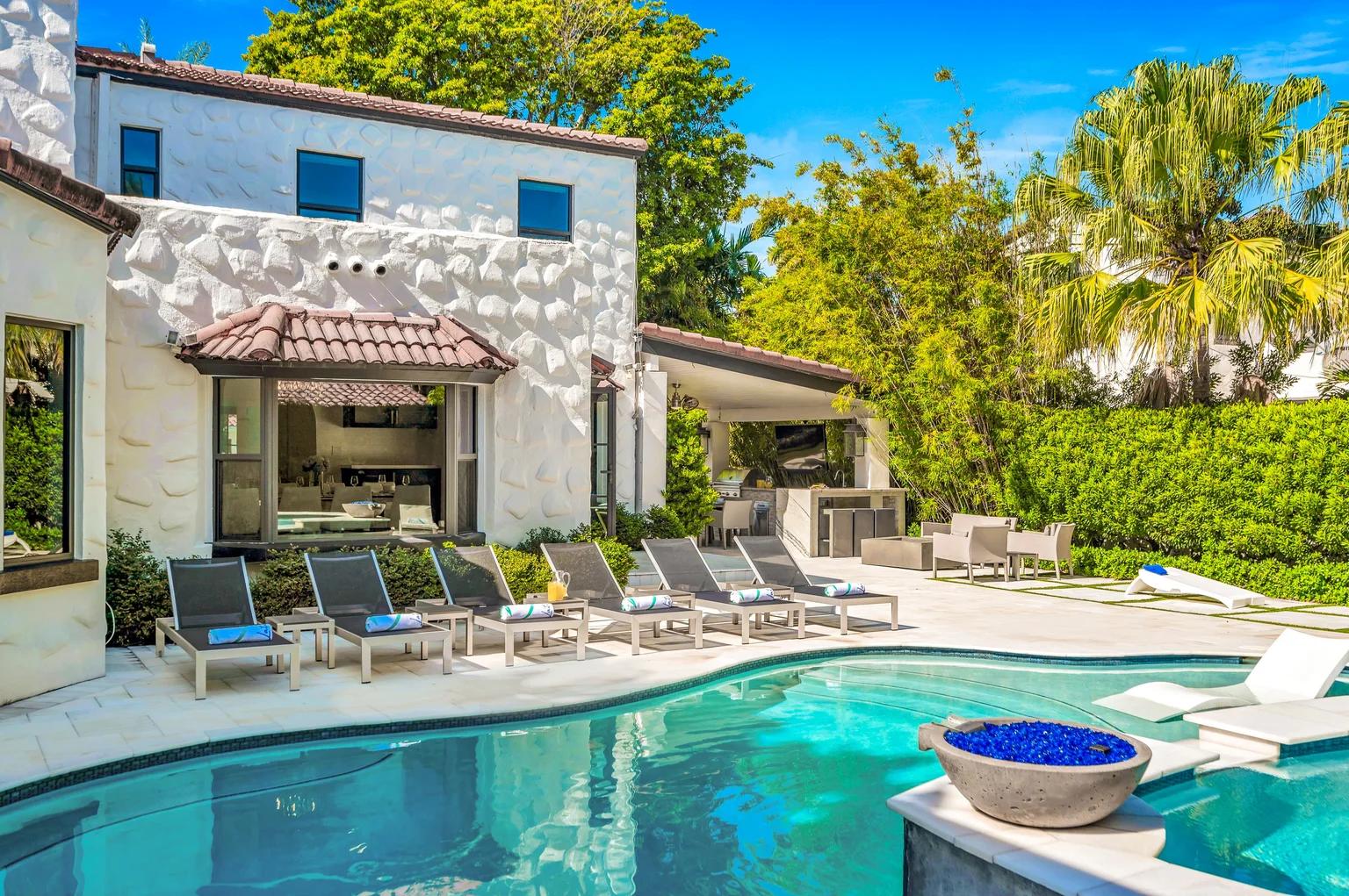 A white house with a swimming pool, lounge chairs, and an outdoor kitchen area surrounded by lush greenery.​​​​‌﻿‍﻿​‍​‍‌‍﻿﻿‌﻿​‍‌‍‍‌‌‍‌﻿‌‍‍‌‌‍﻿‍​‍​‍​﻿‍‍​‍​‍‌﻿​﻿‌‍​‌‌‍﻿‍‌‍‍‌‌﻿‌​‌﻿‍‌​‍﻿‍‌‍‍‌‌‍﻿﻿​‍​‍​‍﻿​​‍​‍‌‍‍​‌﻿​‍‌‍‌‌‌‍‌‍​‍​‍​﻿‍‍​‍​‍​‍﻿﻿‌﻿​﻿‌﻿‌​‌﻿‌‌‌‍‌​‌‍‍‌‌‍﻿﻿​‍﻿﻿‌‍‍‌‌‍﻿‍‌﻿‌​‌‍‌‌‌‍﻿‍‌﻿‌​​‍﻿﻿‌‍‌‌‌‍‌​‌‍‍‌‌﻿‌​​‍﻿﻿‌‍﻿‌‌‍﻿﻿‌‍‌​‌‍‌‌​﻿﻿‌‌﻿​​‌﻿​‍‌‍‌‌‌﻿​﻿‌‍‌‌‌‍﻿‍‌﻿‌​‌‍​‌‌﻿‌​‌‍‍‌‌‍﻿﻿‌‍﻿‍​﻿‍﻿‌‍‍‌‌‍‌​​﻿﻿‌​﻿​‌​﻿​﻿​﻿‌﻿‌‍‌‍​﻿‌​​﻿‌﻿​﻿​‍​﻿‌﻿​‍﻿‌​﻿​﻿​﻿‌​‌‍​‍​﻿​﻿​‍﻿‌​﻿‌​‌‍‌‍​﻿​‍‌‍​‍​‍﻿‌​﻿‍​‌‍​‌‌‍‌​‌‍​‍​‍﻿‌‌‍‌‌​﻿‍​‌‍​﻿​﻿​‌​﻿‌‍​﻿​‌​﻿​​​﻿‍​​﻿‍​‌‍‌‍​﻿​‌‌‍‌​​﻿‍﻿‌﻿‌​‌﻿‍‌‌﻿​​‌‍‌‌​﻿﻿‌‌﻿​​‌‍﻿﻿‌﻿​﻿‌﻿‌​​﻿‍﻿‌﻿​​‌‍​‌‌﻿‌​‌‍‍​​﻿﻿‌‌‍​﻿‌‍﻿﻿‌﻿‌‍‌‍‌‌‌﻿​‍‌​‍‌‌‍﻿‌‌‍​‌‌‍‌﻿‌‍‌‌​‍﻿‍‌‍​‌‌‍﻿​‌﻿‌​​﻿﻿﻿‌‍​‍‌‍​‌‌﻿​﻿‌‍‌‌‌‌‌‌‌﻿​‍‌‍﻿​​﻿﻿‌​‍‌‌​﻿​‍‌​‌‍‌﻿​﻿‌﻿‌​‌﻿‌‌‌‍‌​‌‍‍‌‌‍﻿﻿​‍‌‍‌‍‍‌‌‍‌​​﻿﻿‌​﻿​‌​﻿​﻿​﻿‌﻿‌‍‌‍​﻿‌​​﻿‌﻿​﻿​‍​﻿‌﻿​‍﻿‌​﻿​﻿​﻿‌​‌‍​‍​﻿​﻿​‍﻿‌​﻿‌​‌‍‌‍​﻿​‍‌‍​‍​‍﻿‌​﻿‍​‌‍​‌‌‍‌​‌‍​‍​‍﻿‌‌‍‌‌​﻿‍​‌‍​﻿​﻿​‌​﻿‌‍​﻿​‌​﻿​​​﻿‍​​﻿‍​‌‍‌‍​﻿​‌‌‍‌​​‍‌‍‌﻿‌​‌﻿‍‌‌﻿​​‌‍‌‌​﻿﻿‌‌﻿​​‌‍﻿﻿‌﻿​﻿‌﻿‌​​‍‌‍‌﻿​​‌‍​‌‌﻿‌​‌‍‍​​﻿﻿‌‌‍​﻿‌‍﻿﻿‌﻿‌‍‌‍‌‌‌﻿​‍‌​‍‌‌‍﻿‌‌‍​‌‌‍‌﻿‌‍‌‌​‍﻿‍‌‍​‌‌‍﻿​‌﻿‌​​‍‌‍‌﻿​​‌‍‌‌‌﻿​‍‌﻿​﻿‌﻿​​‌‍‌‌‌‍​﻿‌﻿‌​‌‍‍‌‌﻿‌‍‌‍‌‌​﻿﻿‌‌﻿​​‌﻿‌‌‌‍​‍‌‍﻿​‌‍‍‌‌﻿​﻿‌‍‍​‌‍‌‌‌‍‌​​‍​‍‌﻿﻿‌