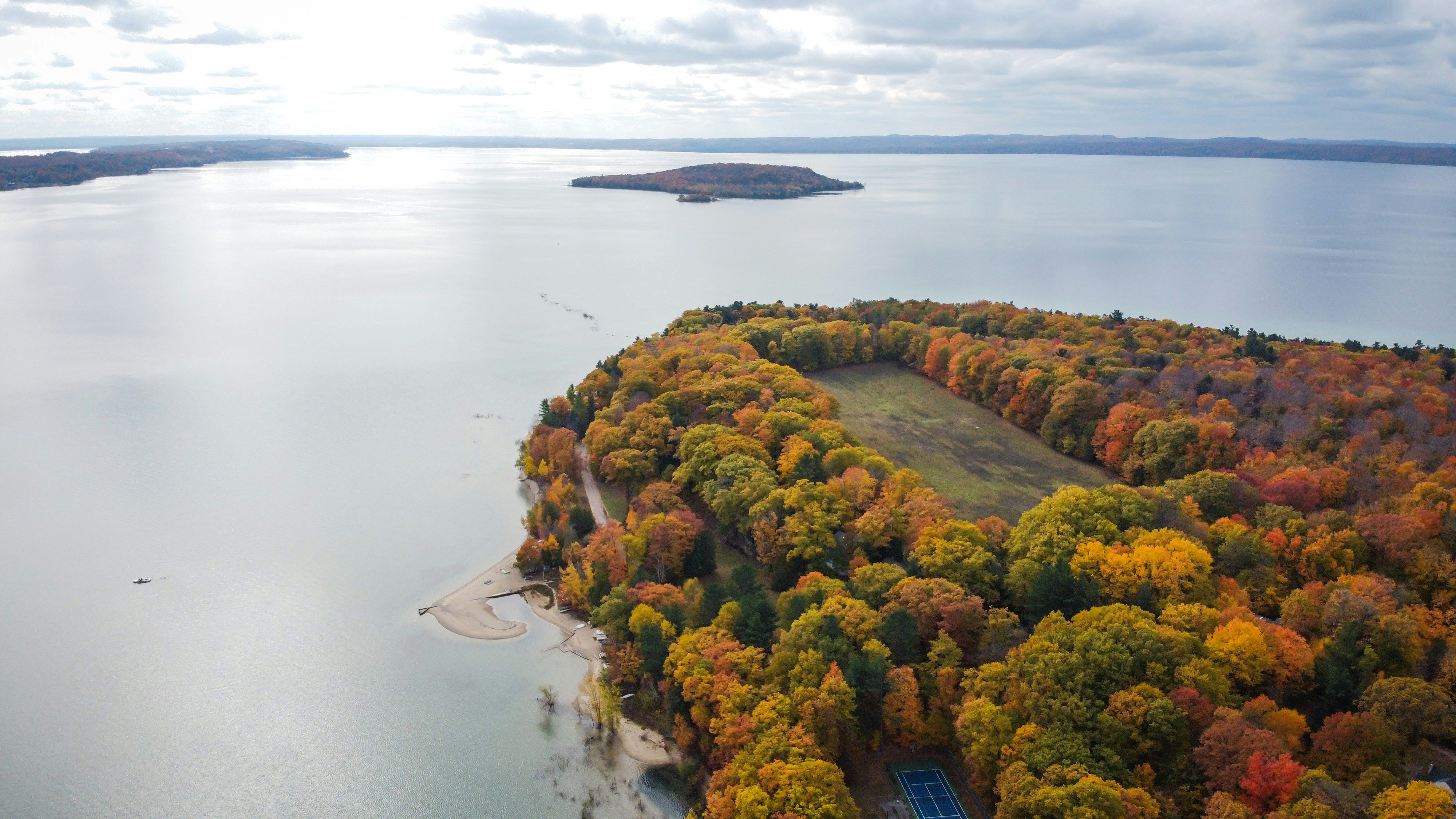 Aerial view of a lake with a peninsula covered in vibrant autumn trees, a sandy beach, and an island in the distance.​​​​‌﻿‍﻿​‍​‍‌‍﻿﻿‌﻿​‍‌‍‍‌‌‍‌﻿‌‍‍‌‌‍﻿‍​‍​‍​﻿‍‍​‍​‍‌﻿​﻿‌‍​‌‌‍﻿‍‌‍‍‌‌﻿‌​‌﻿‍‌​‍﻿‍‌‍‍‌‌‍﻿﻿​‍​‍​‍﻿​​‍​‍‌‍‍​‌﻿​‍‌‍‌‌‌‍‌‍​‍​‍​﻿‍‍​‍​‍​‍﻿﻿‌﻿​﻿‌﻿‌​‌﻿‌‌‌‍‌​‌‍‍‌‌‍﻿﻿​‍﻿﻿‌‍‍‌‌‍﻿‍‌﻿‌​‌‍‌‌‌‍﻿‍‌﻿‌​​‍﻿﻿‌‍‌‌‌‍‌​‌‍‍‌‌﻿‌​​‍﻿﻿‌‍﻿‌‌‍﻿﻿‌‍‌​‌‍‌‌​﻿﻿‌‌﻿​​‌﻿​‍‌‍‌‌‌﻿​﻿‌‍‌‌‌‍﻿‍‌﻿‌​‌‍​‌‌﻿‌​‌‍‍‌‌‍﻿﻿‌‍﻿‍​﻿‍﻿‌‍‍‌‌‍‌​​﻿﻿‌​﻿‌﻿‌‍‌​‌‍‌‌​﻿​﻿​﻿​‍​﻿​​‌‍​‌​﻿‌﻿​‍﻿‌​﻿​​​﻿‍‌​﻿‍​​﻿‌﻿​‍﻿‌​﻿‌​​﻿‌﻿​﻿‌​‌‍‌‍​‍﻿‌​﻿‍‌‌‍​‌‌‍‌‌​﻿​﻿​‍﻿‌​﻿​‍‌‍‌‍​﻿‍‌‌‍‌​​﻿‍​​﻿‍​​﻿‌‌​﻿‍‌‌‍‌‌‌‍‌‌​﻿‌‍‌‍‌‌​﻿‍﻿‌﻿‌​‌﻿‍‌‌﻿​​‌‍‌‌​﻿﻿‌‌﻿​​‌‍﻿﻿‌﻿​﻿‌﻿‌​​﻿‍﻿‌﻿​​‌‍​‌‌﻿‌​‌‍‍​​﻿﻿‌‌‍​﻿‌‍﻿﻿‌﻿‌‍‌‍‌‌‌﻿​‍‌​‍‌‌‍﻿‌‌‍​‌‌‍‌﻿‌‍‌‌​‍﻿‍‌‍​‌‌‍﻿​‌﻿‌​​﻿﻿﻿‌‍​‍‌‍​‌‌﻿​﻿‌‍‌‌‌‌‌‌‌﻿​‍‌‍﻿​​﻿﻿‌​‍‌‌​﻿​‍‌​‌‍‌﻿​﻿‌﻿‌​‌﻿‌‌‌‍‌​‌‍‍‌‌‍﻿﻿​‍‌‍‌‍‍‌‌‍‌​​﻿﻿‌​﻿‌﻿‌‍‌​‌‍‌‌​﻿​﻿​﻿​‍​﻿​​‌‍​‌​﻿‌﻿​‍﻿‌​﻿​​​﻿‍‌​﻿‍​​﻿‌﻿​‍﻿‌​﻿‌​​﻿‌﻿​﻿‌​‌‍‌‍​‍﻿‌​﻿‍‌‌‍​‌‌‍‌‌​﻿​﻿​‍﻿‌​﻿​‍‌‍‌‍​﻿‍‌‌‍‌​​﻿‍​​﻿‍​​﻿‌‌​﻿‍‌‌‍‌‌‌‍‌‌​﻿‌‍‌‍‌‌​‍‌‍‌﻿‌​‌﻿‍‌‌﻿​​‌‍‌‌​﻿﻿‌‌﻿​​‌‍﻿﻿‌﻿​﻿‌﻿‌​​‍‌‍‌﻿​​‌‍​‌‌﻿‌​‌‍‍​​﻿﻿‌‌‍​﻿‌‍﻿﻿‌﻿‌‍‌‍‌‌‌﻿​‍‌​‍‌‌‍﻿‌‌‍​‌‌‍‌﻿‌‍‌‌​‍﻿‍‌‍​‌‌‍﻿​‌﻿‌​​‍‌‍‌﻿​​‌‍‌‌‌﻿​‍‌﻿​﻿‌﻿​​‌‍‌‌‌‍​﻿‌﻿‌​‌‍‍‌‌﻿‌‍‌‍‌‌​﻿﻿‌‌﻿​​‌﻿‌‌‌‍​‍‌‍﻿​‌‍‍‌‌﻿​﻿‌‍‍​‌‍‌‌‌‍‌​​‍​‍‌﻿﻿‌