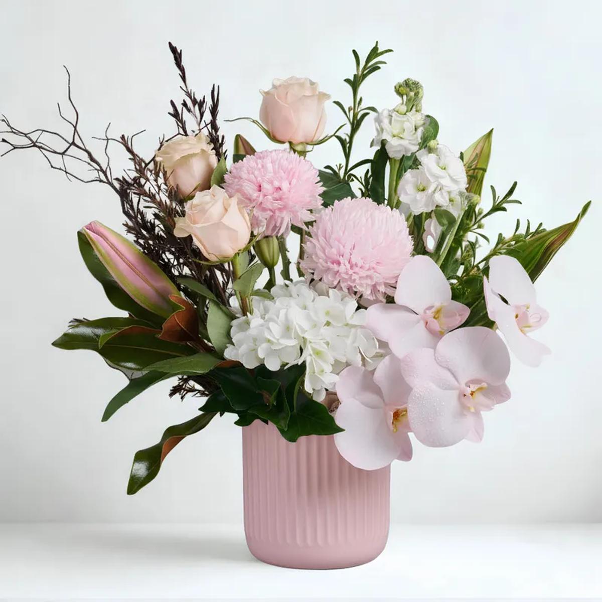 Hydrangea and rose arrangement in ribbed vase