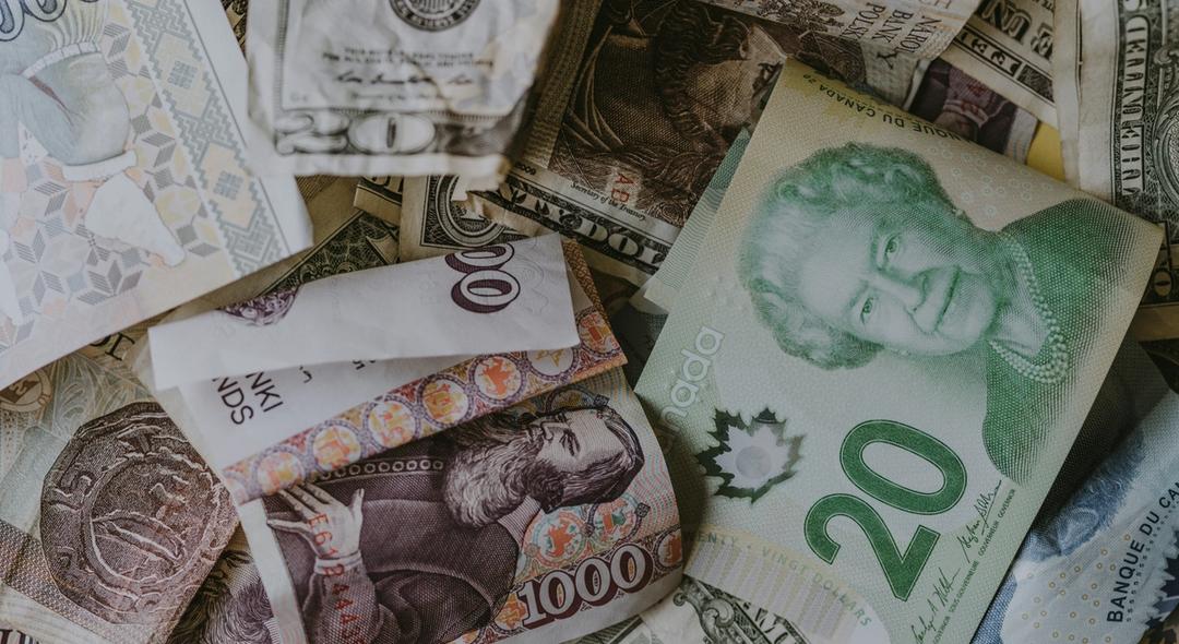 Pile of different banknotes.