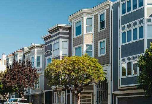 Row of apartments with trees.