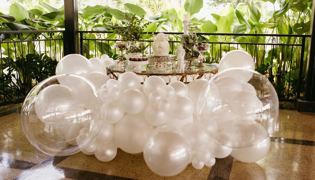 White and clear balloon display for an event.